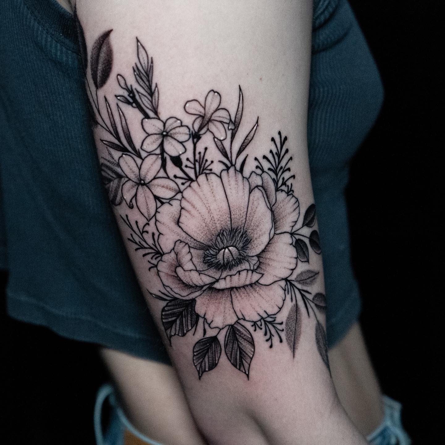 Floral bouquet realism tattoo on the forearm by all gas no brakes! no days off!