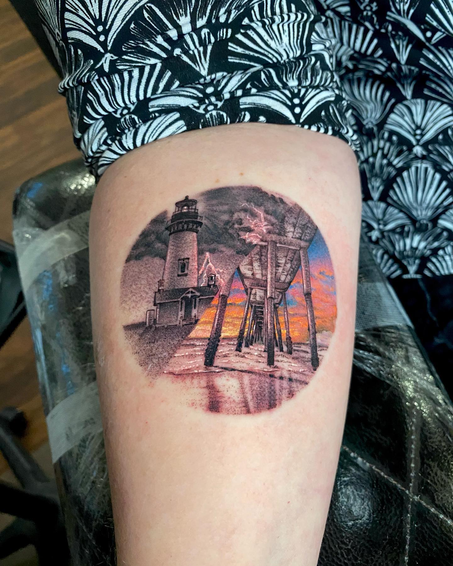 Lighthouse and pier realism tattoo on the thigh by D Benzo ~ San Diego Tattoo artist ~