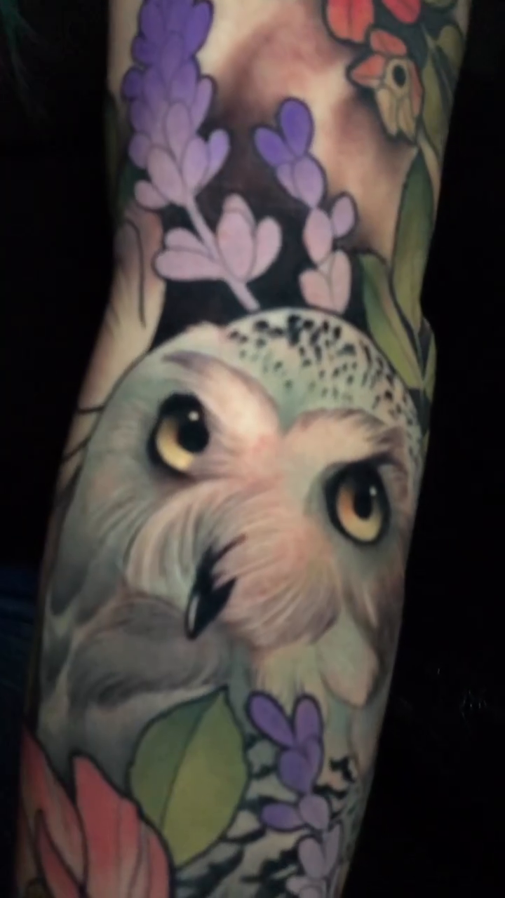 Snowy owl with flowers realism tattoo by Evin Pfaff, Bedford, Pennsylvania