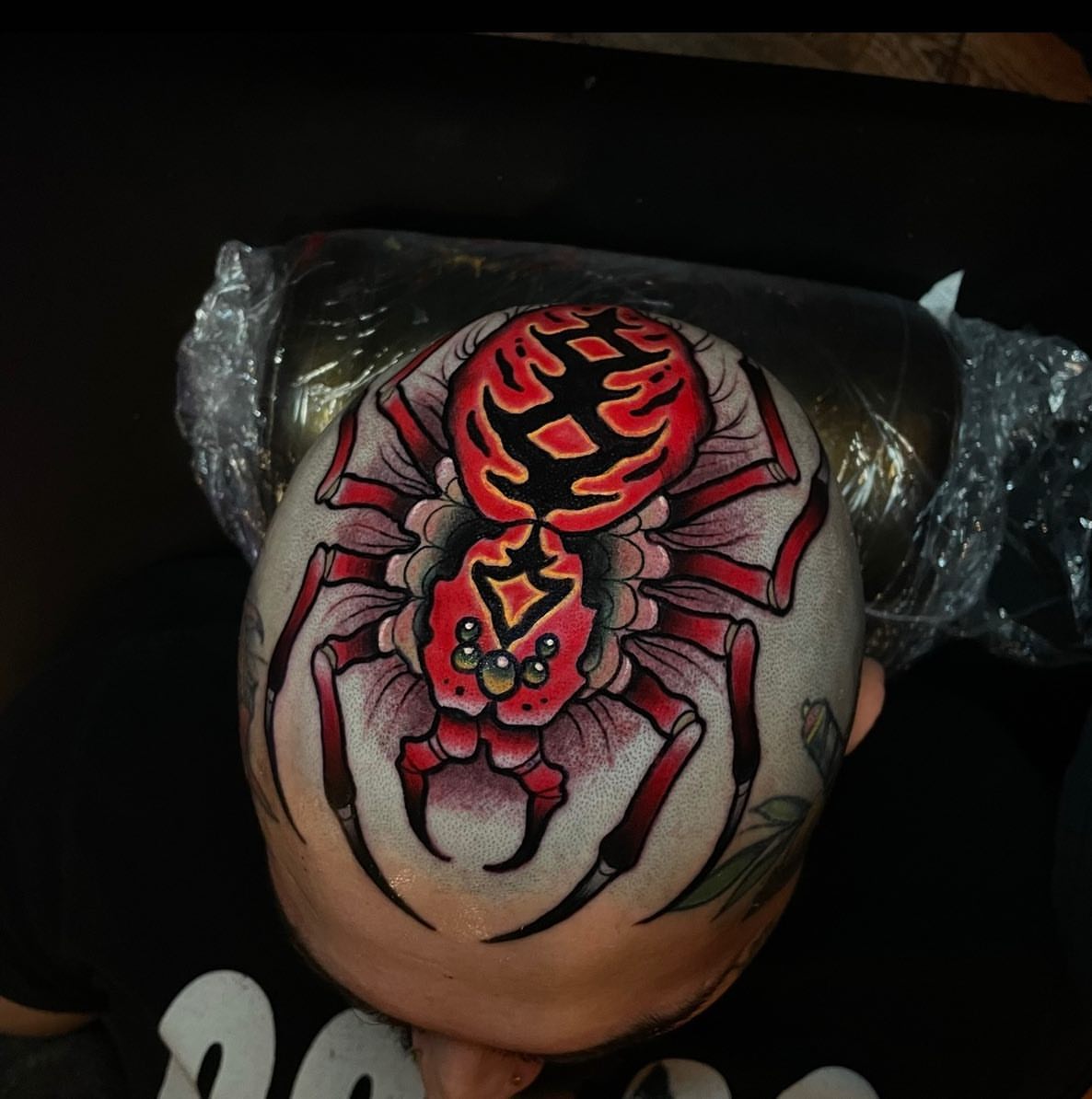 Spider dotwork tattoo on the head by Ick Abrams