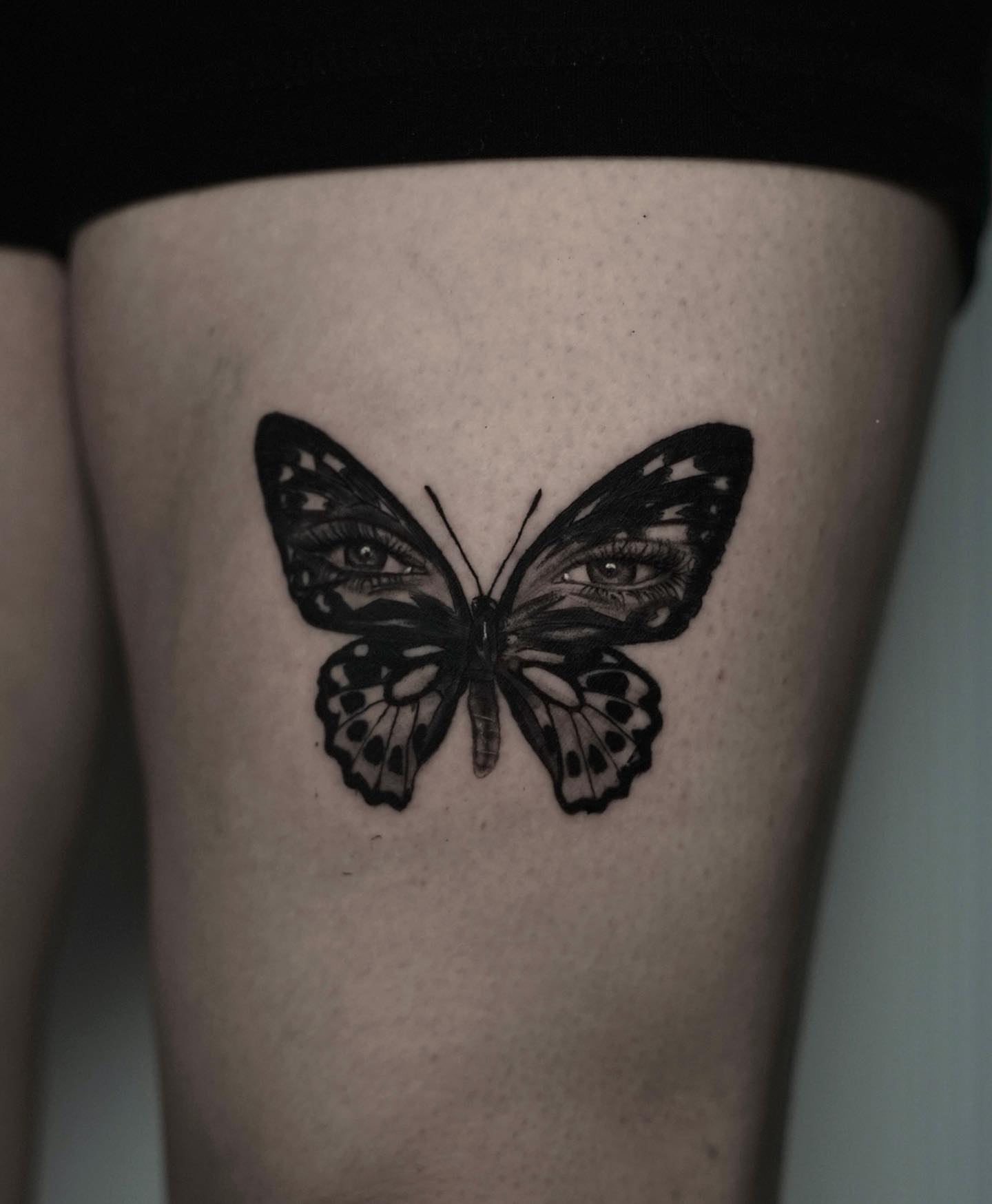 Butterfly black and grey tattoo on the forearm by Dallas Tattoo Artist