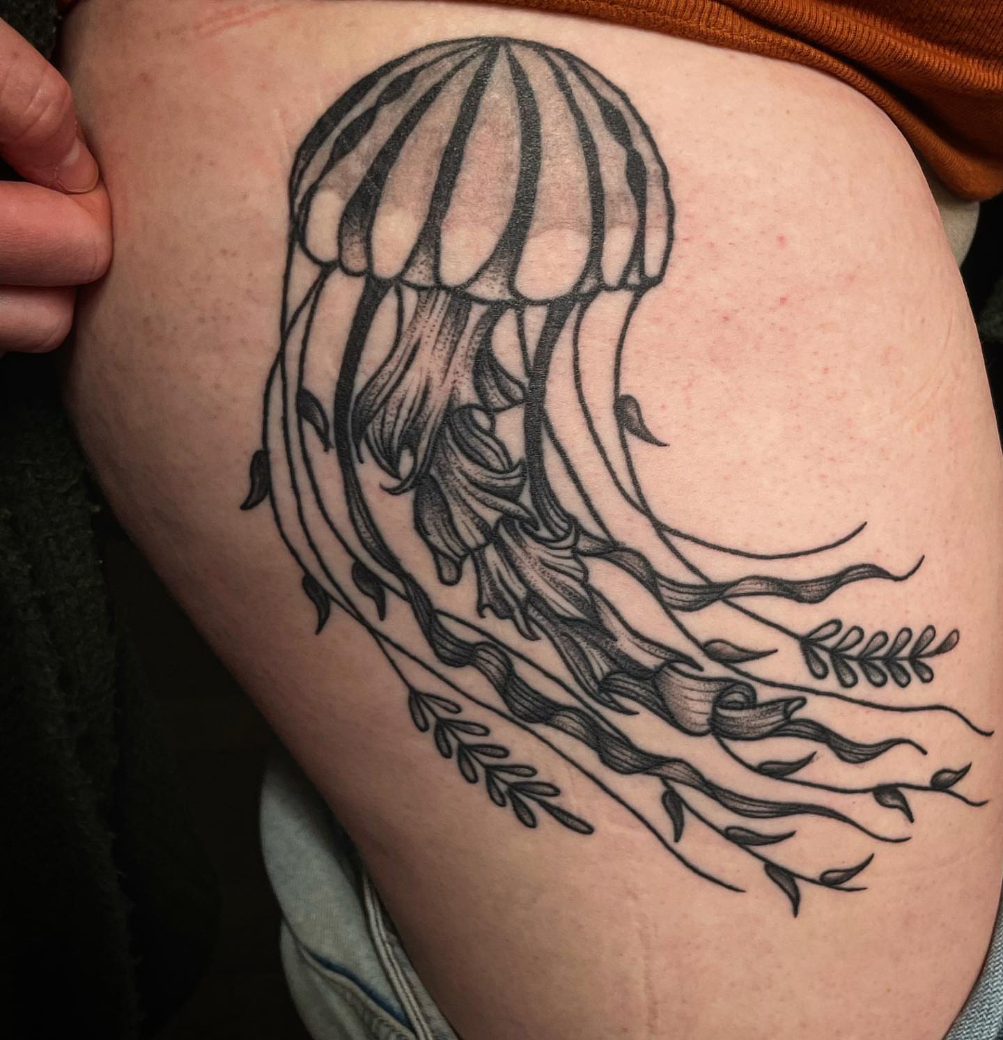 Jellyfish black and grey tattoo on the thigh by Kimberly Shordon