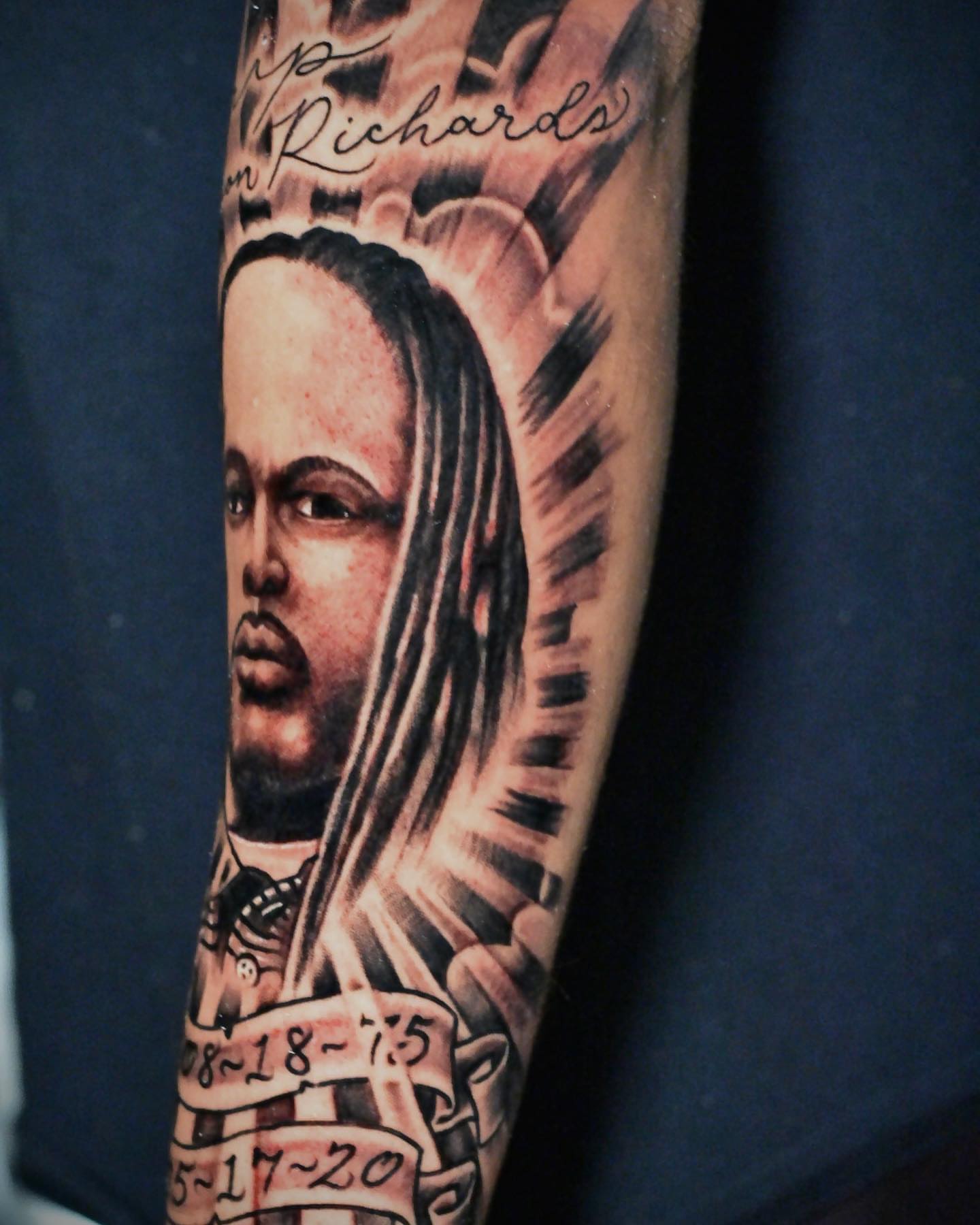 Portrait realism tattoo on the forearm by Raul Ortiz