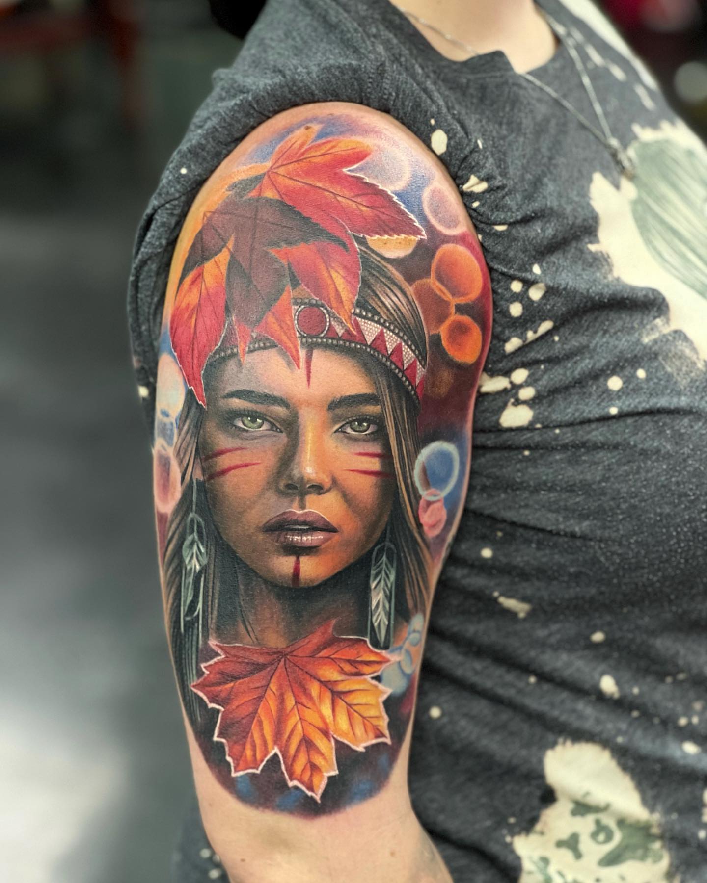 Indigenous woman with autumn leaves realism tattoo on the forearm by Mary Blake Tattoos, Franklin, Tennessee