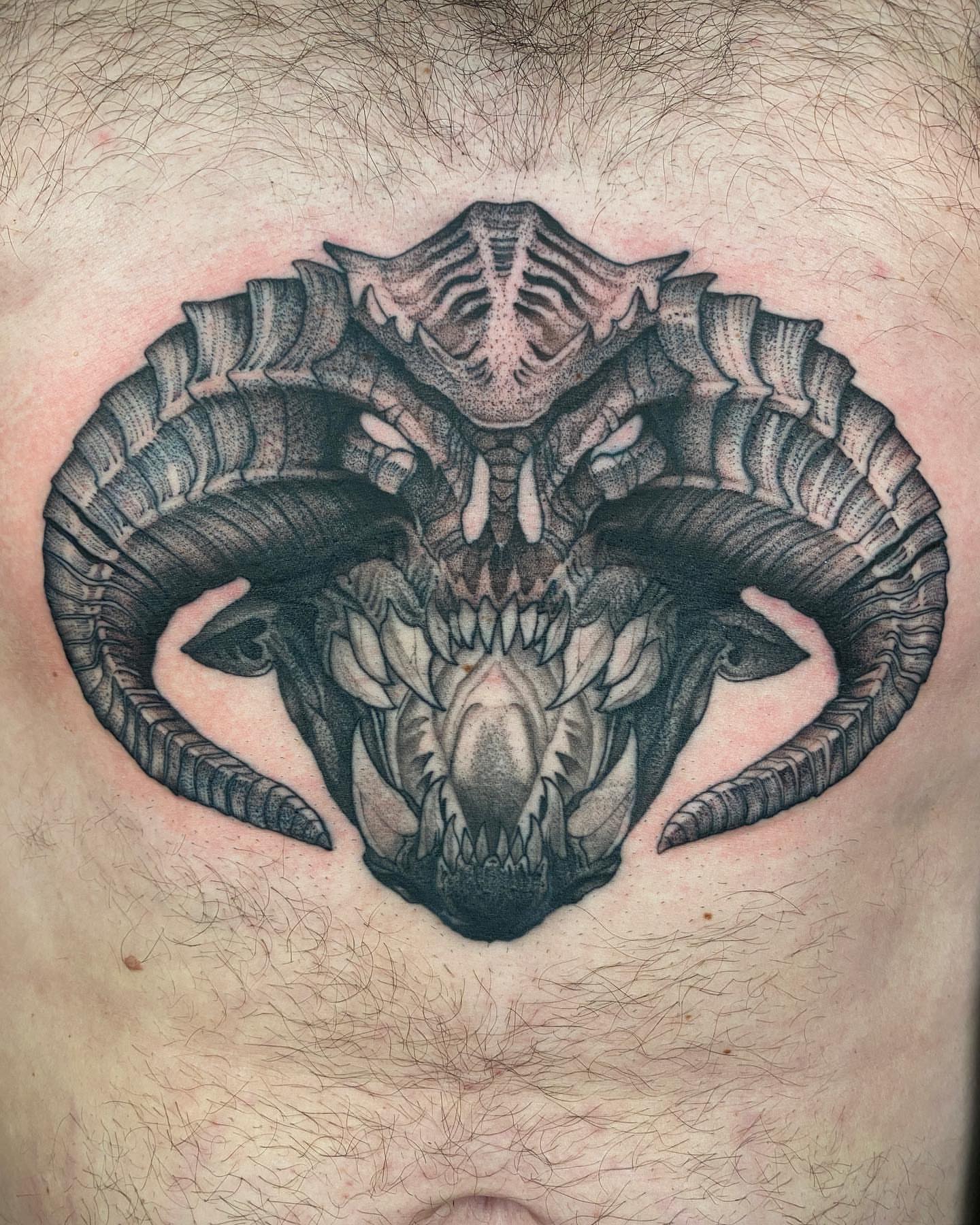 Ram skull realism tattoo on the chest by Tattoo Artist
