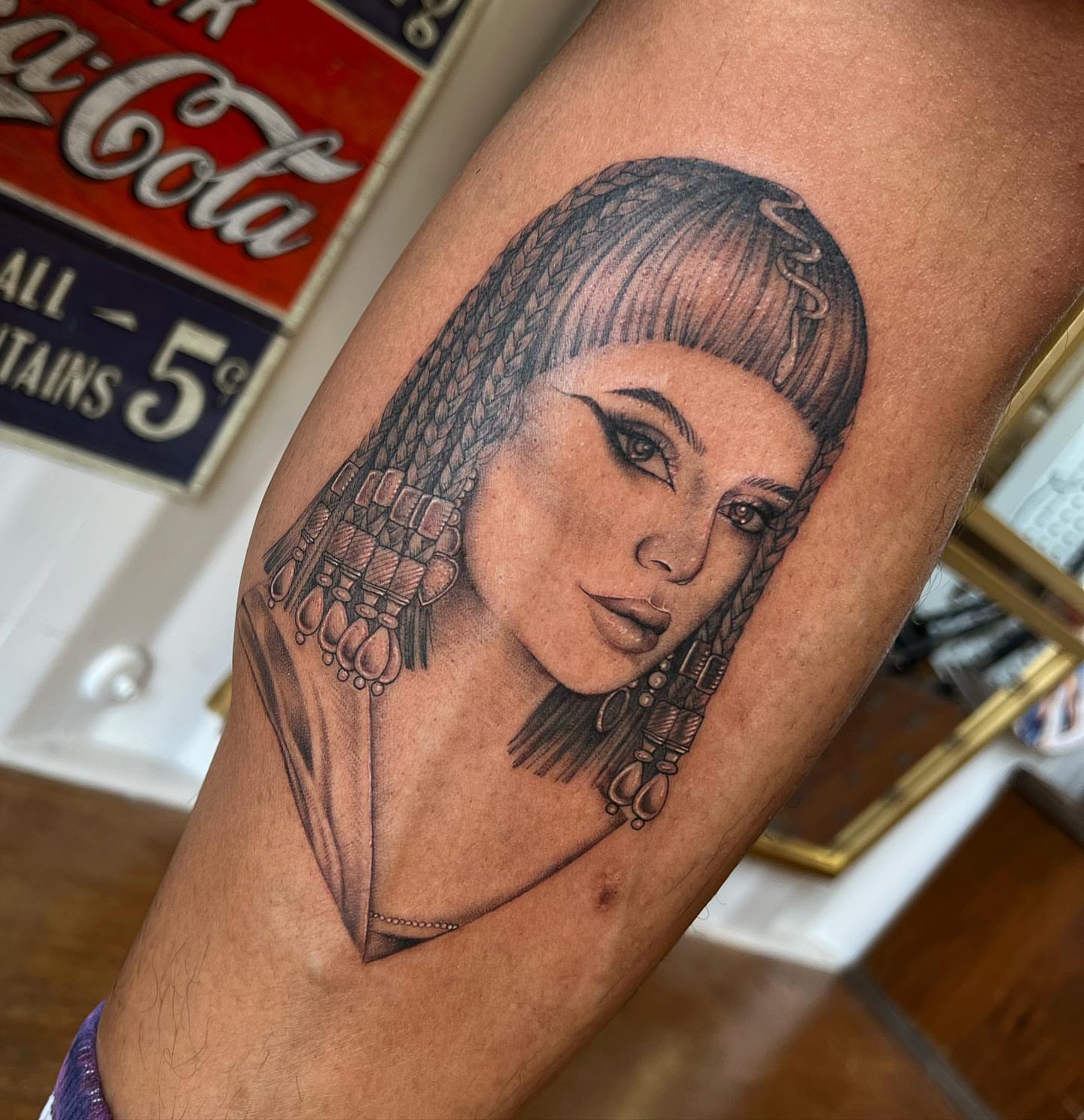 Woman with braids black and grey tattoo on the forearm by ✨ Jaden Belle Tattoos ✨
