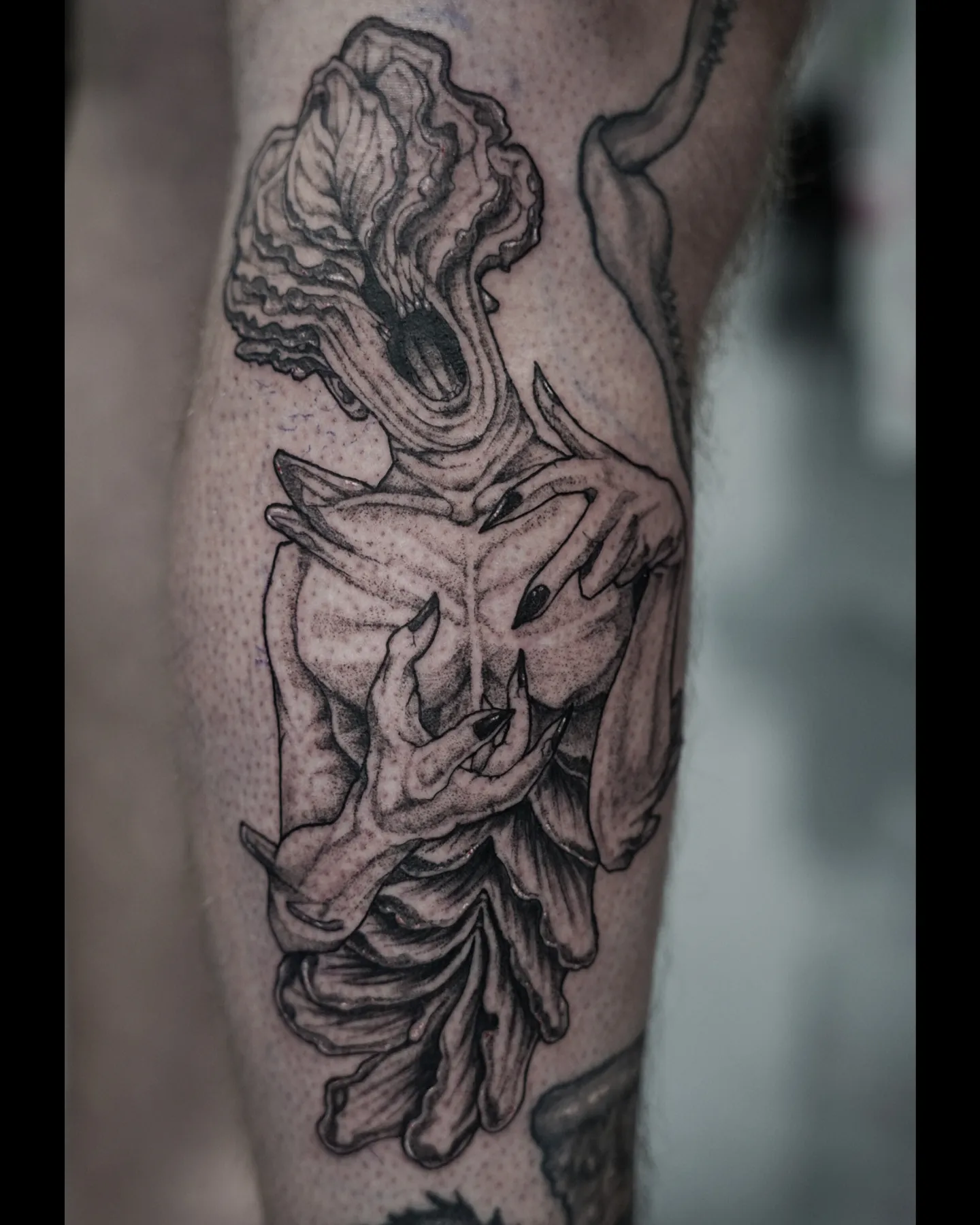 Abstract figure dotwork tattoo on the forearm by EyeSee Tattoos