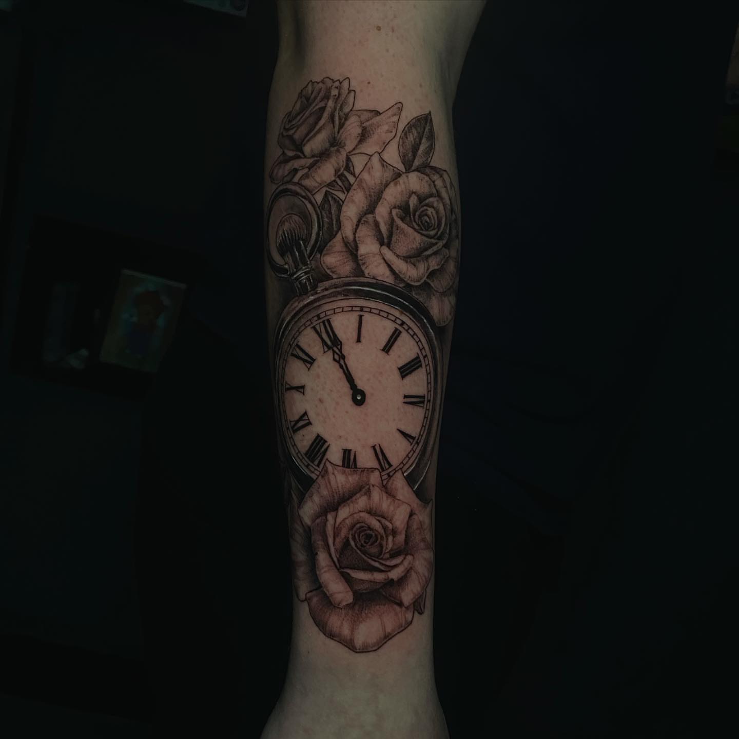 Clock and roses realism tattoo on the forearm by Sydney Dixon, Sacramento, California