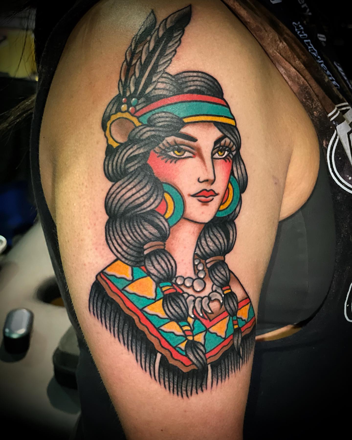 Indian woman American traditional tattoo on the shoulder by Alex Muniz