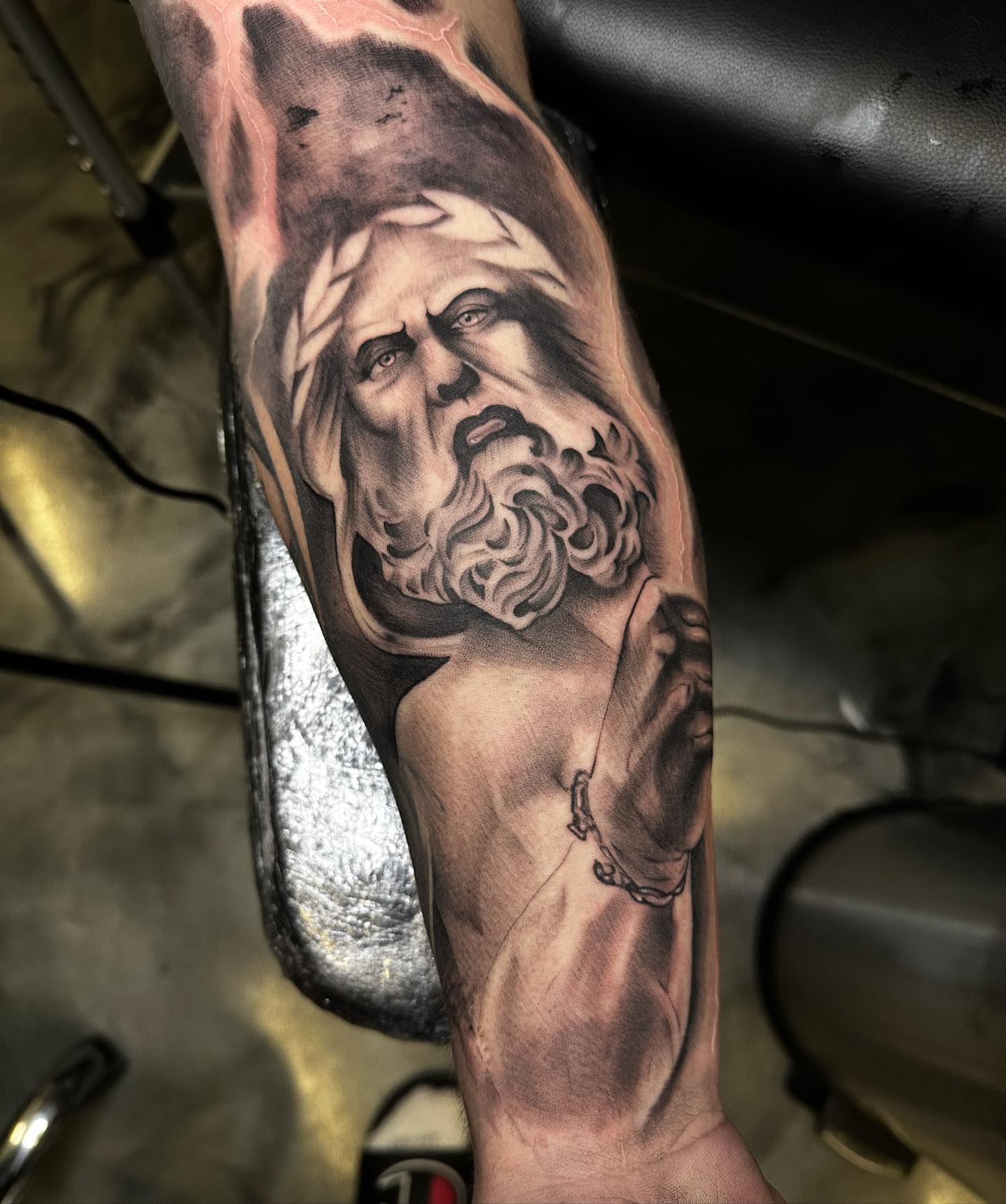 God-like figure realism tattoo on the forearm by Tattoosxjoseph