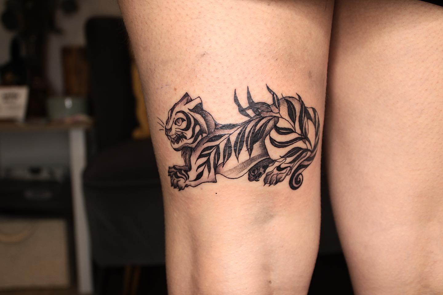Tiger black and grey tattoo on the thigh by Aim 🤍