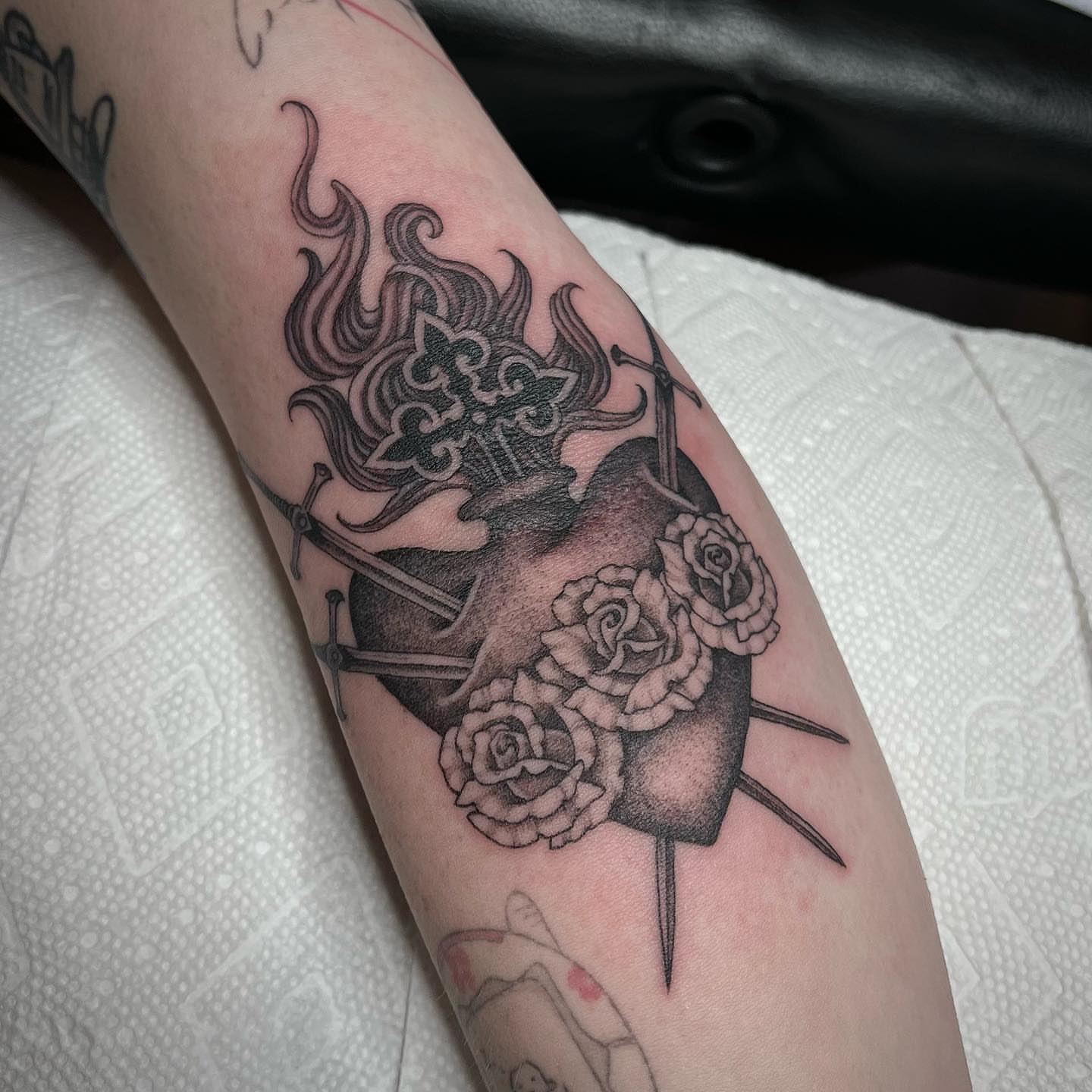 Heart with roses and swords realism tattoo on the forearm by ⛓ Emily ⚔️ Milja ⛓