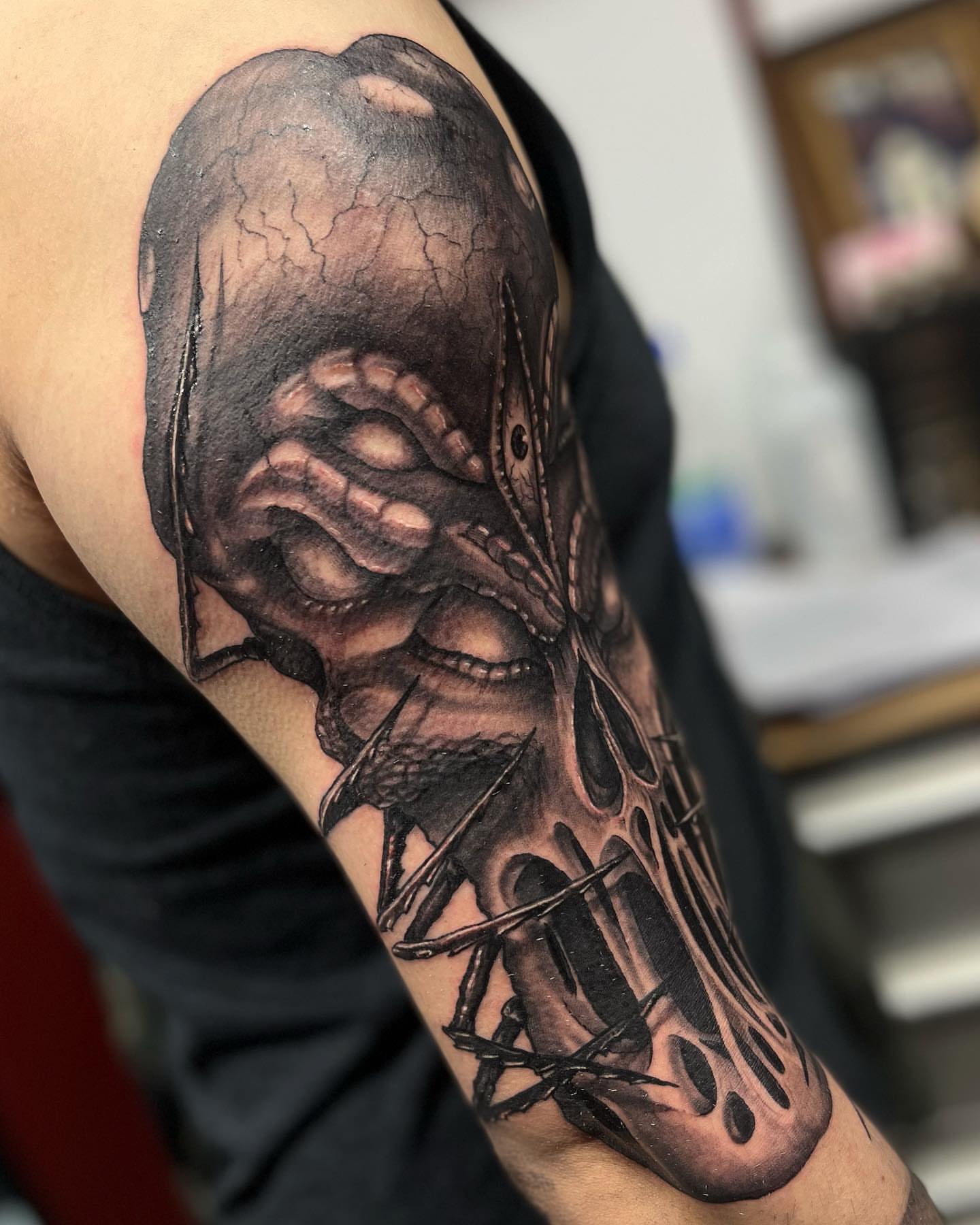 Alien creature realism tattoo on the forearm by Morgan Jones