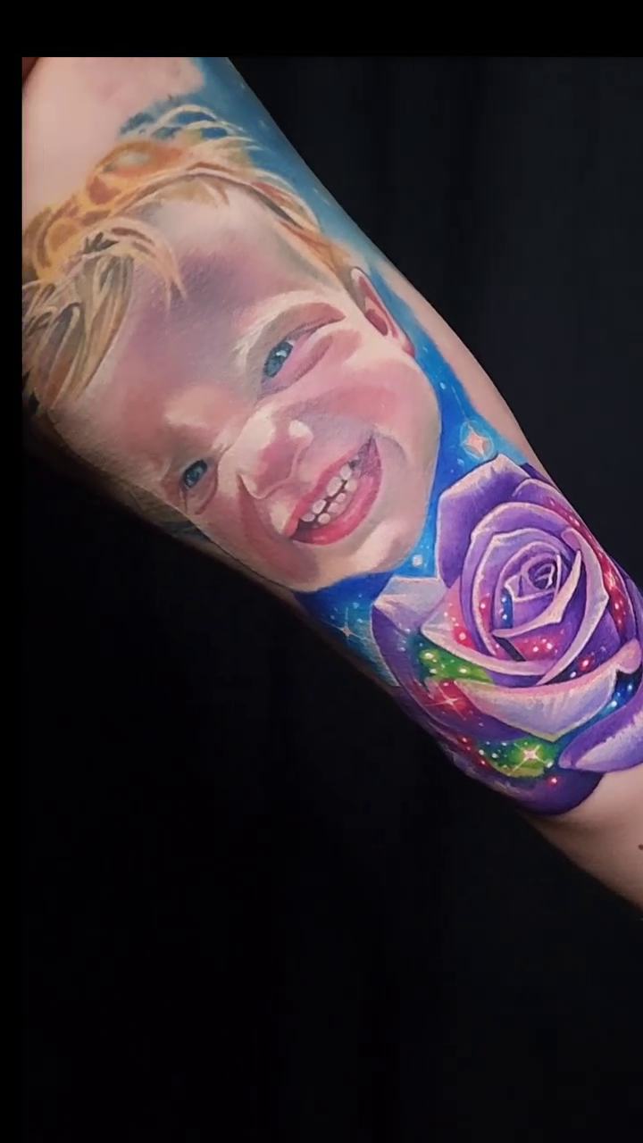 Child portrait with rose realism tattoo by Tyler Malek