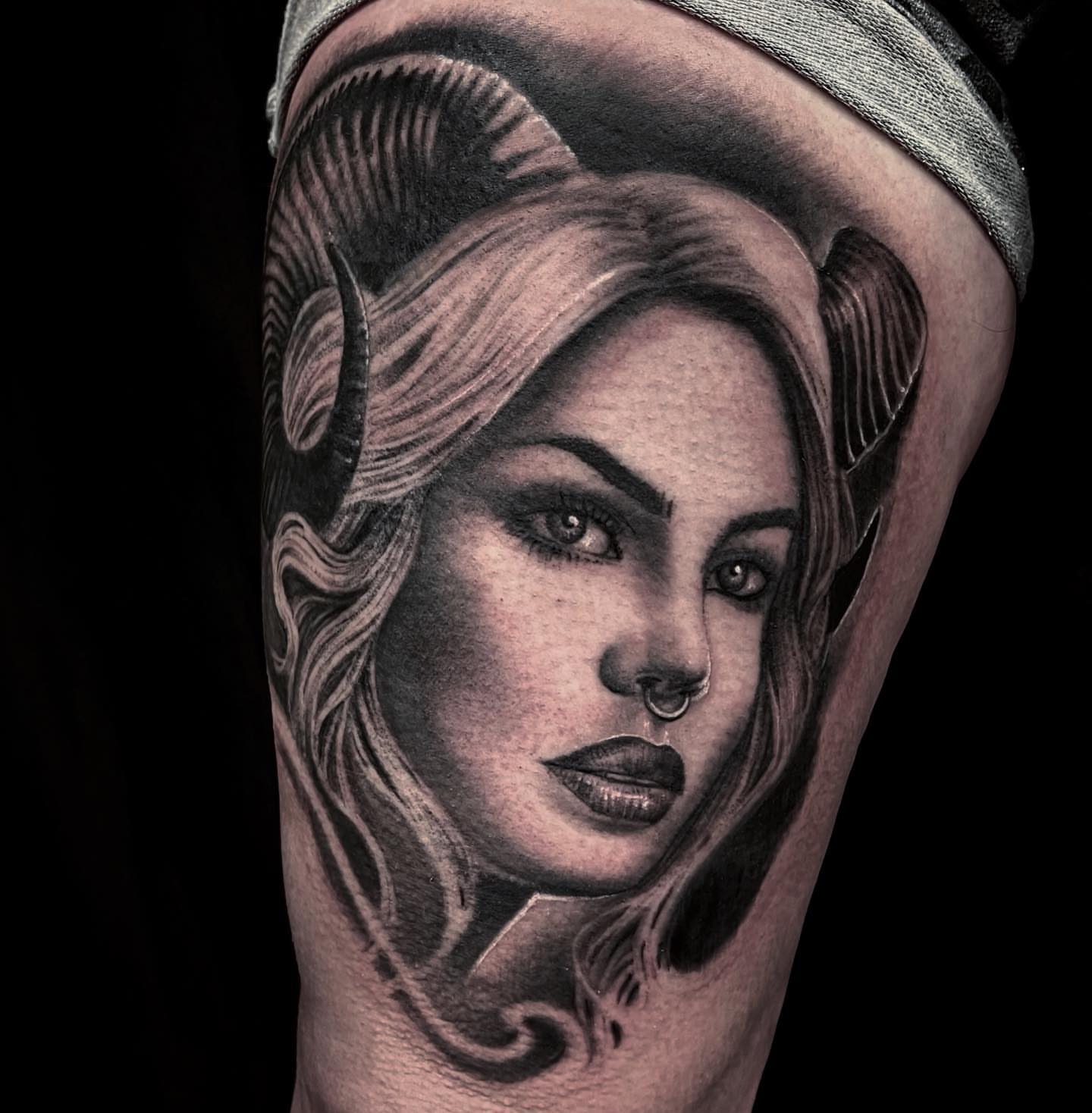 Woman with horns realism tattoo on the thigh by Greg West Sac tattoo artist, West Sacramento, California