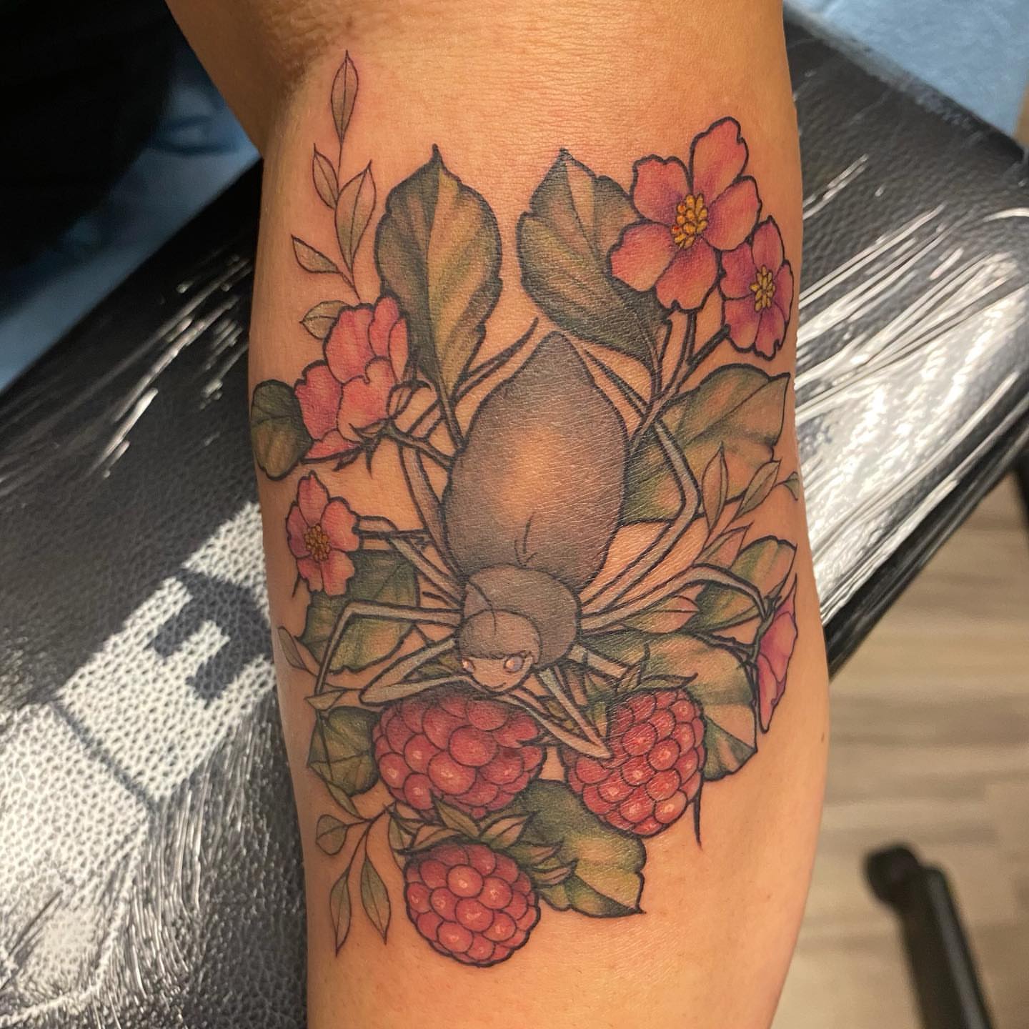Floral arrangement new school tattoo on the forearm by Emily Conner