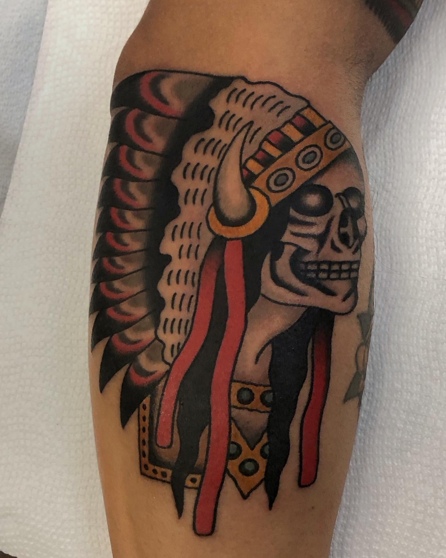 Indian headdress American traditional tattoo on the forearm by Ben Fiedler