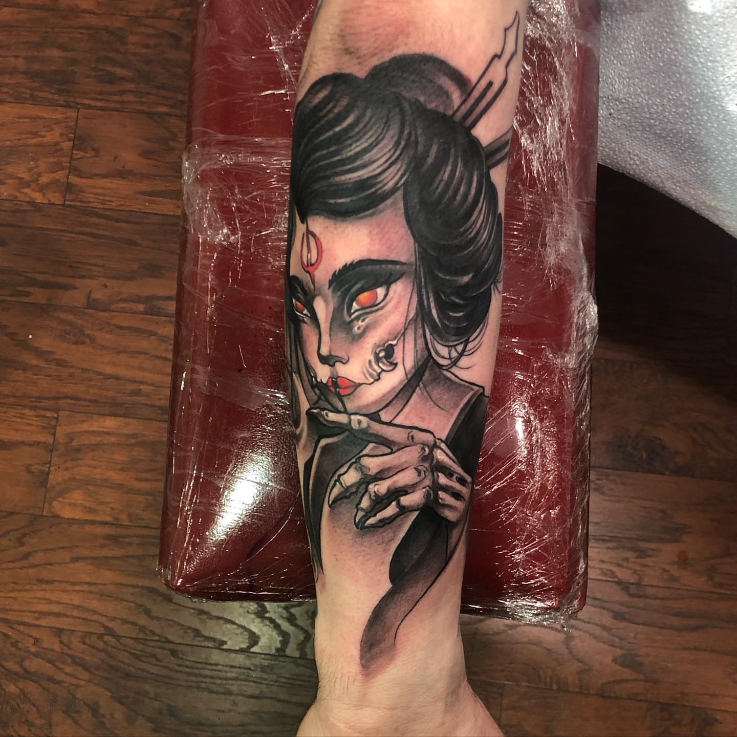 Geisha American traditional tattoo on the forearm by Aaron Borden