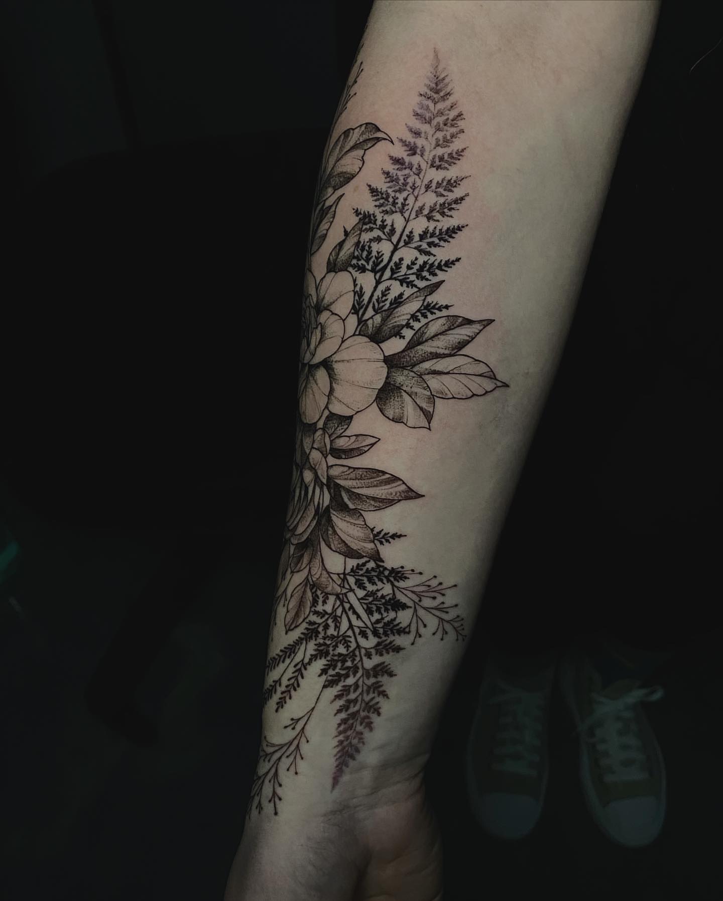 Floral arrangement black and grey tattoo on the forearm by Sydney Dixon, Sacramento, California