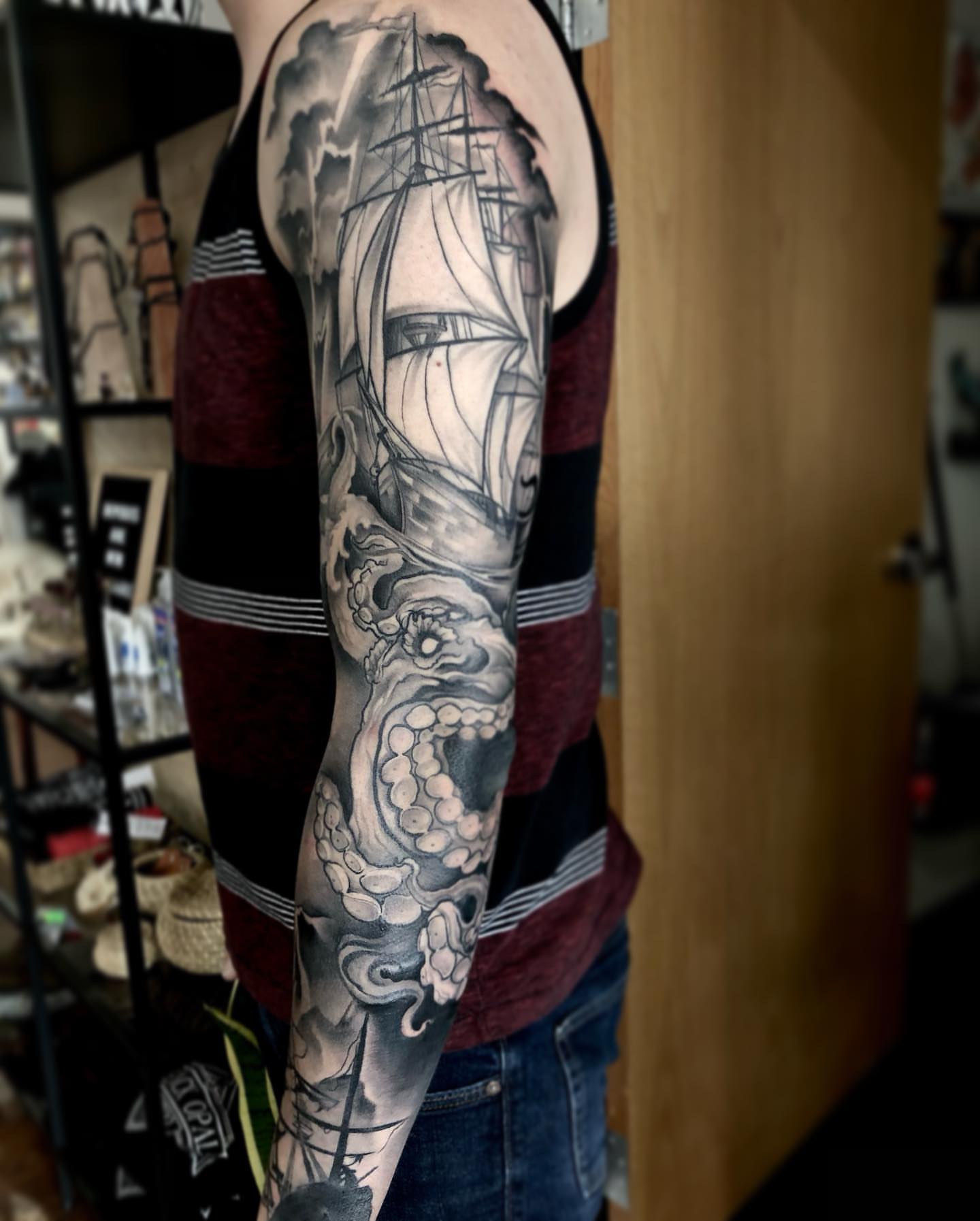 Ship and sea monster realism tattoo on the forearm by Aaron Borden