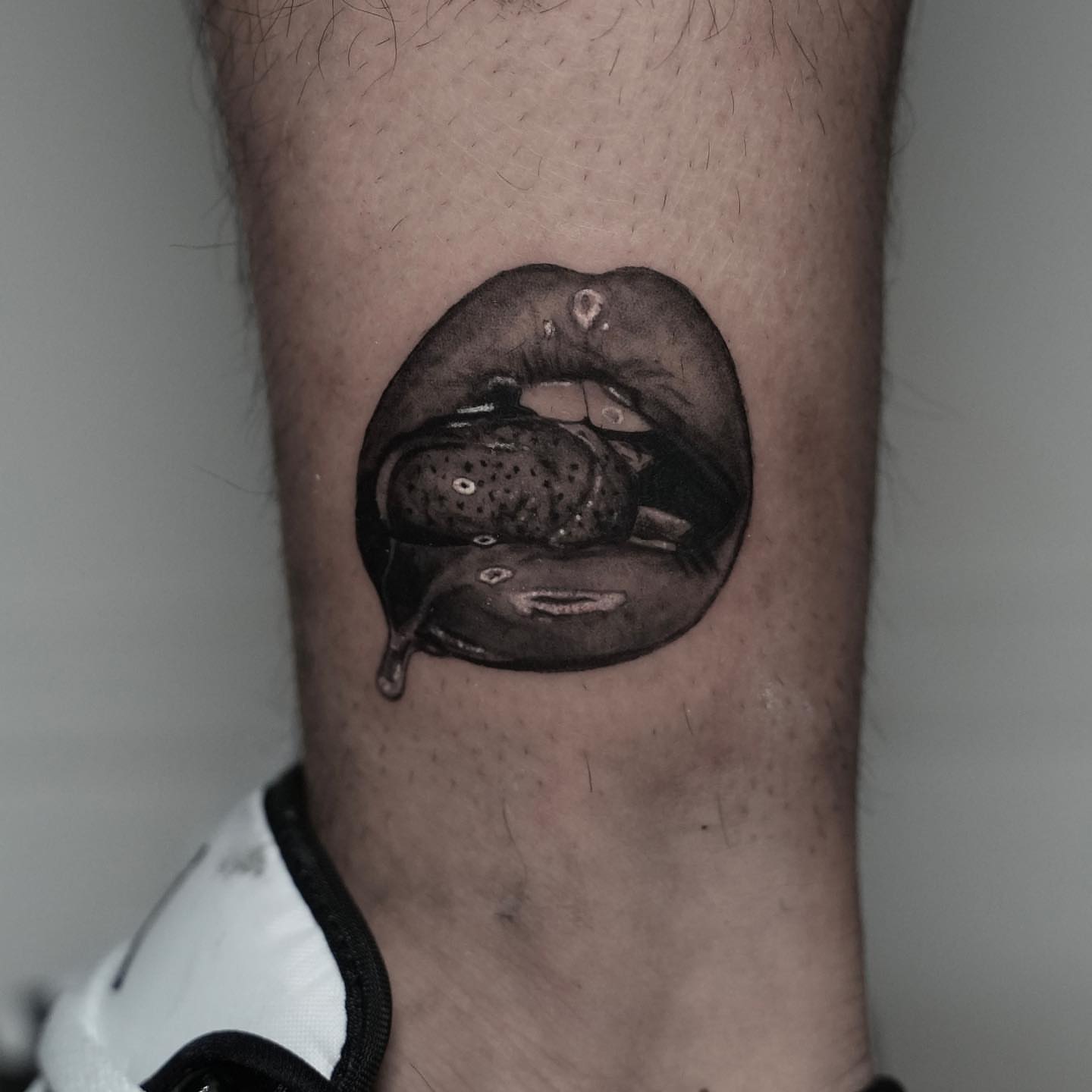 Lips dotwork tattoo on the forearm by Dallas Tattoo Artist