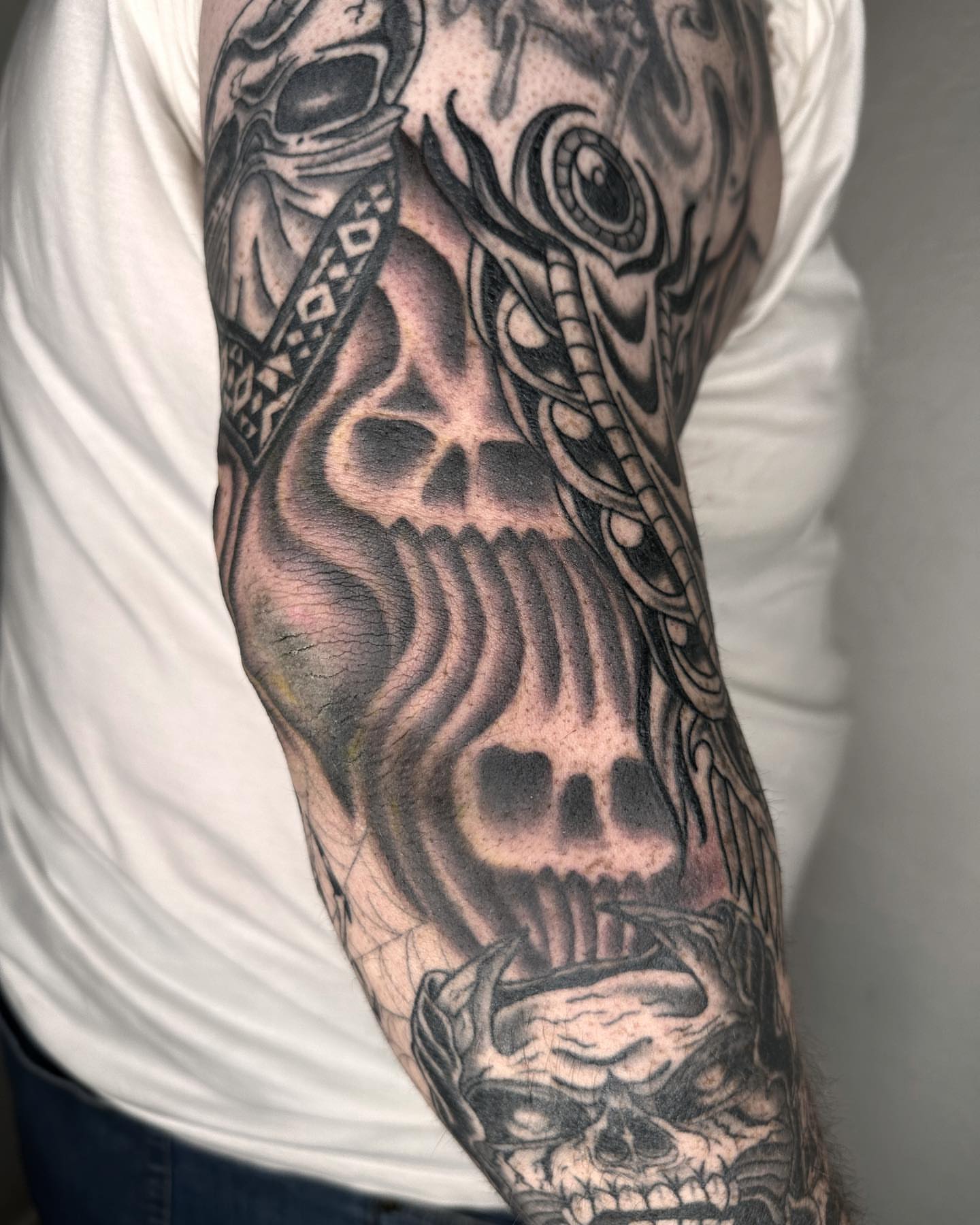 Skull realism tattoo on the forearm by Elijah Edwards