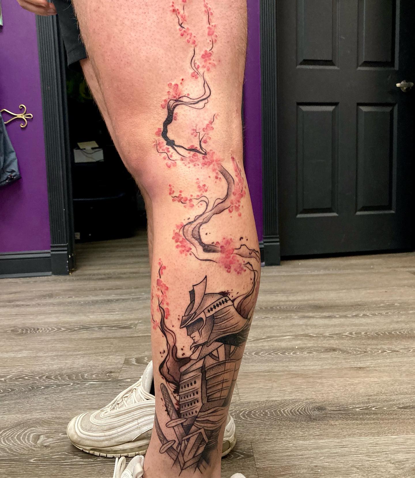 Cherry blossoms and samurai japanese irezumi tattoo on the leg by Hali Larkin