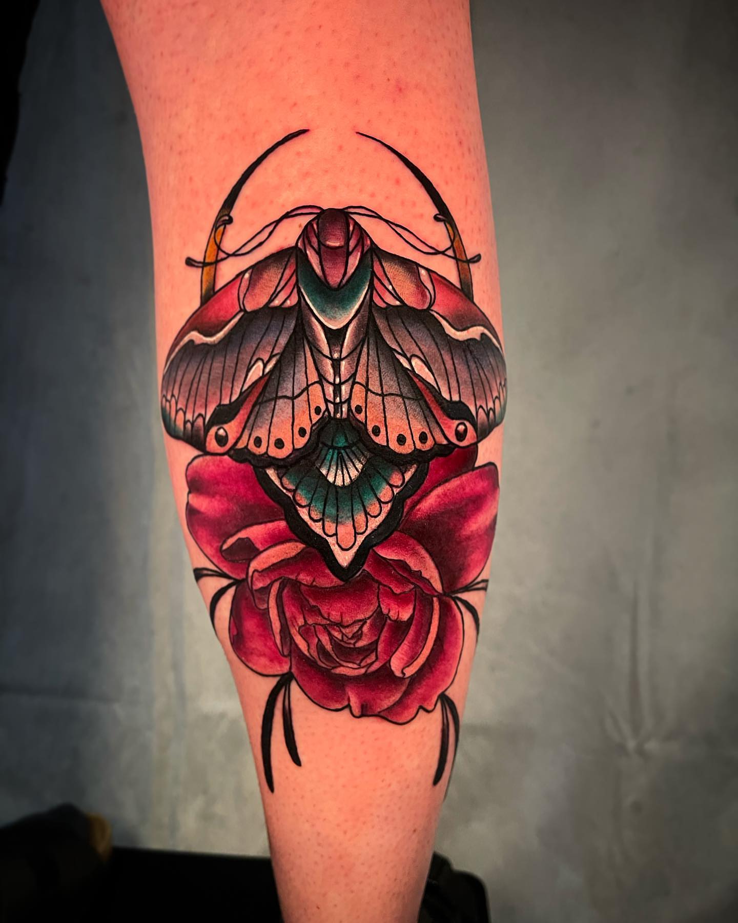 Moth and rose American traditional tattoo on the forearm by 𝓚𝓪𝓼𝓼𝓪𝓷𝓭𝓻𝓪 𝓜𝓬𝓒𝓪𝓵𝓵, Eugene, Oregon