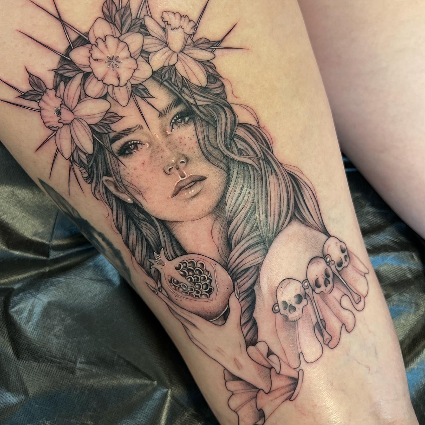 Woman with flowers and skulls realism tattoo on the forearm by ✨ Jaden Belle Tattoos ✨