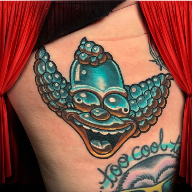 Clown American traditional tattoo on the thigh by Joshua L Wilson, Dayton, Ohio