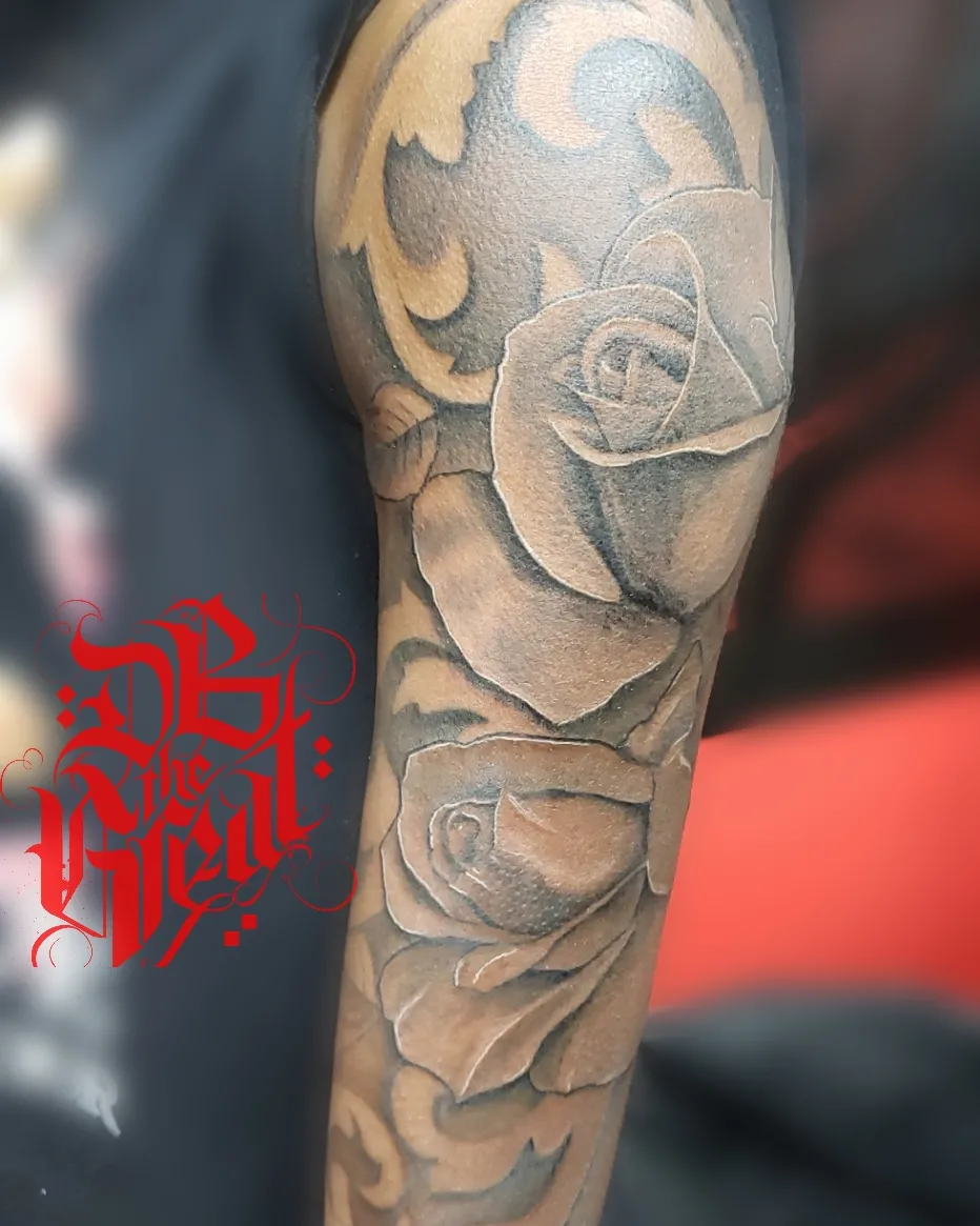 Rose realism tattoo on the forearm by Dannie Blythewood
