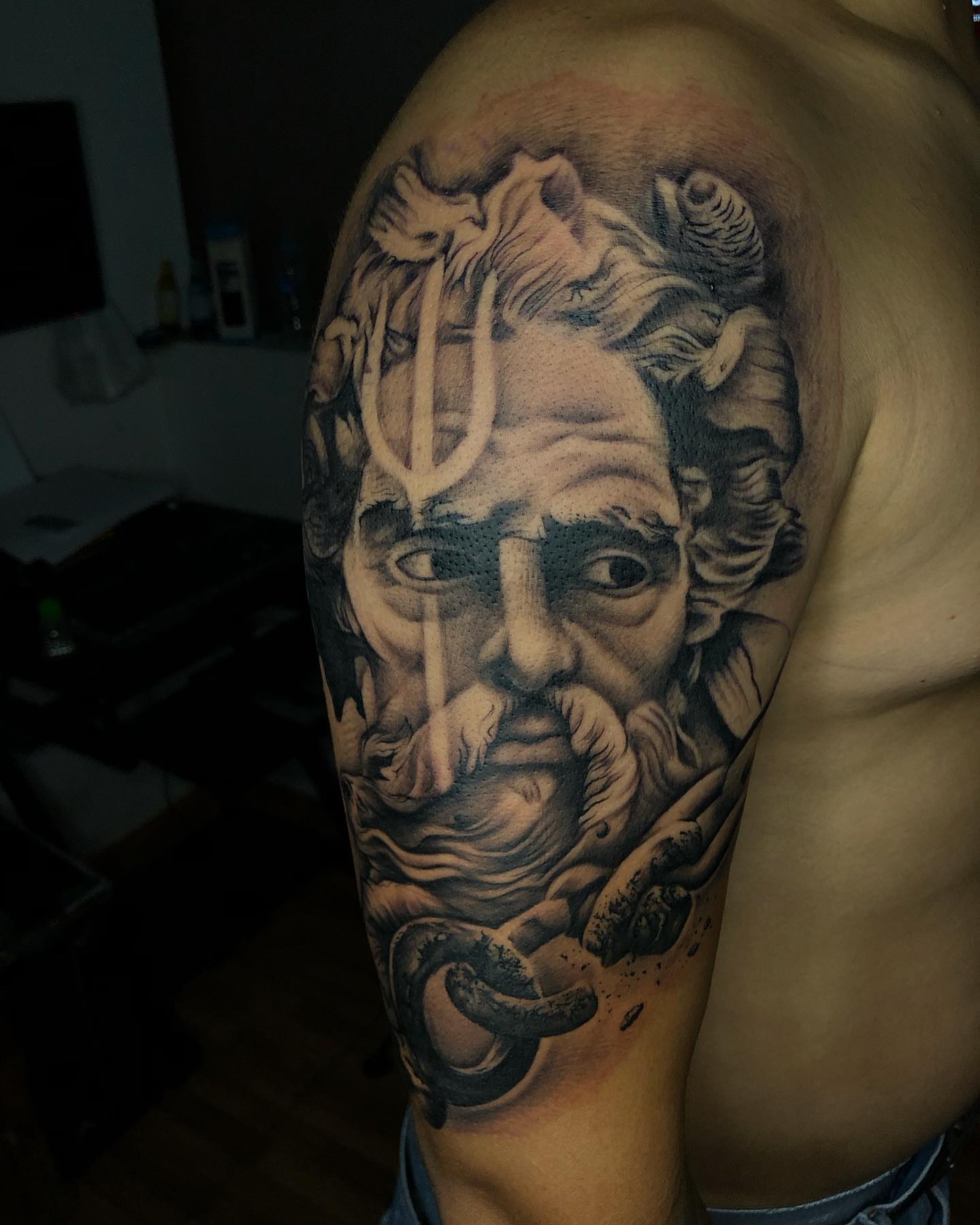 God-like figure realism tattoo on the shoulder by Luis Chauta