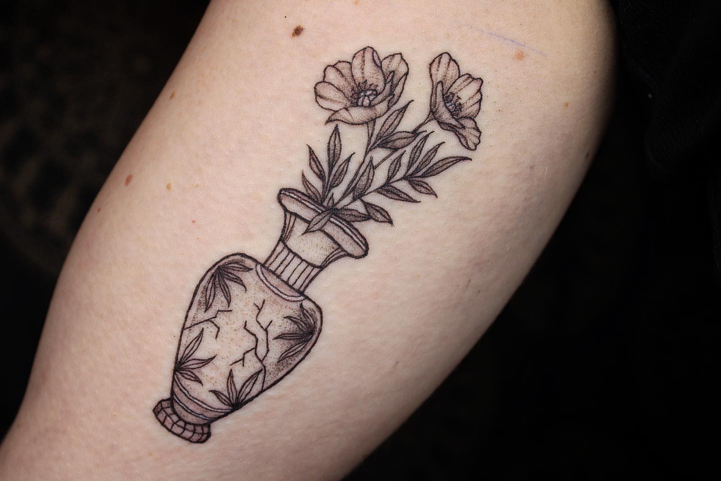 Flower in bottle black and grey tattoo on the forearm by Aim 🤍