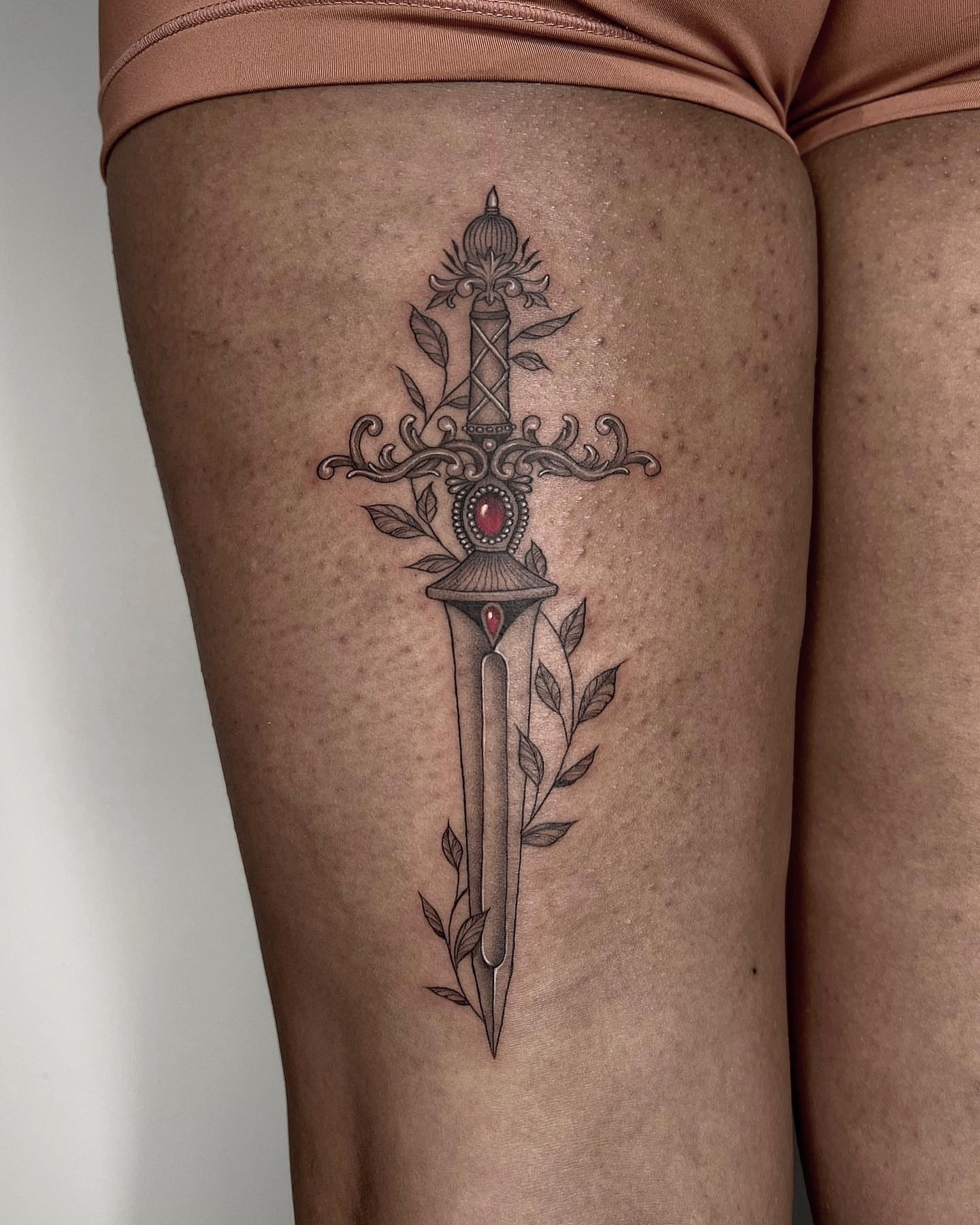 Sword ornamental tattoo on the thigh by hiba ⊹ atlanta tattoo artist, Johns Creek, Georgia