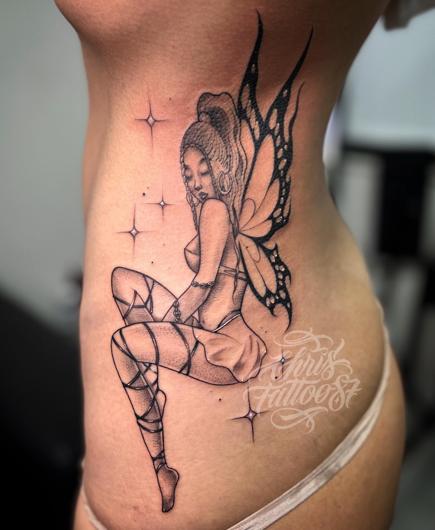 Fairy dotwork tattoo on the ribs by chris tattoo
