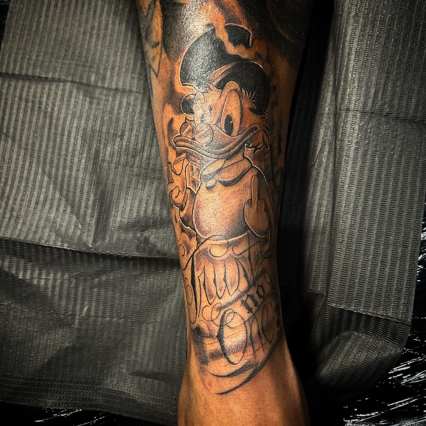 Donald duck American traditional tattoo on the forearm by Visionary Tattoos