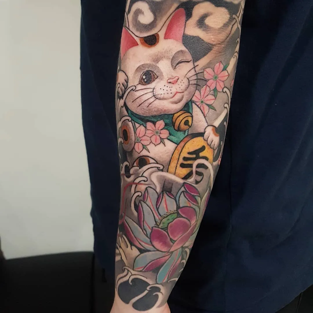 Cat and lotus flower japanese irezumi tattoo on the forearm by zamix_traditional, San Francisco, California