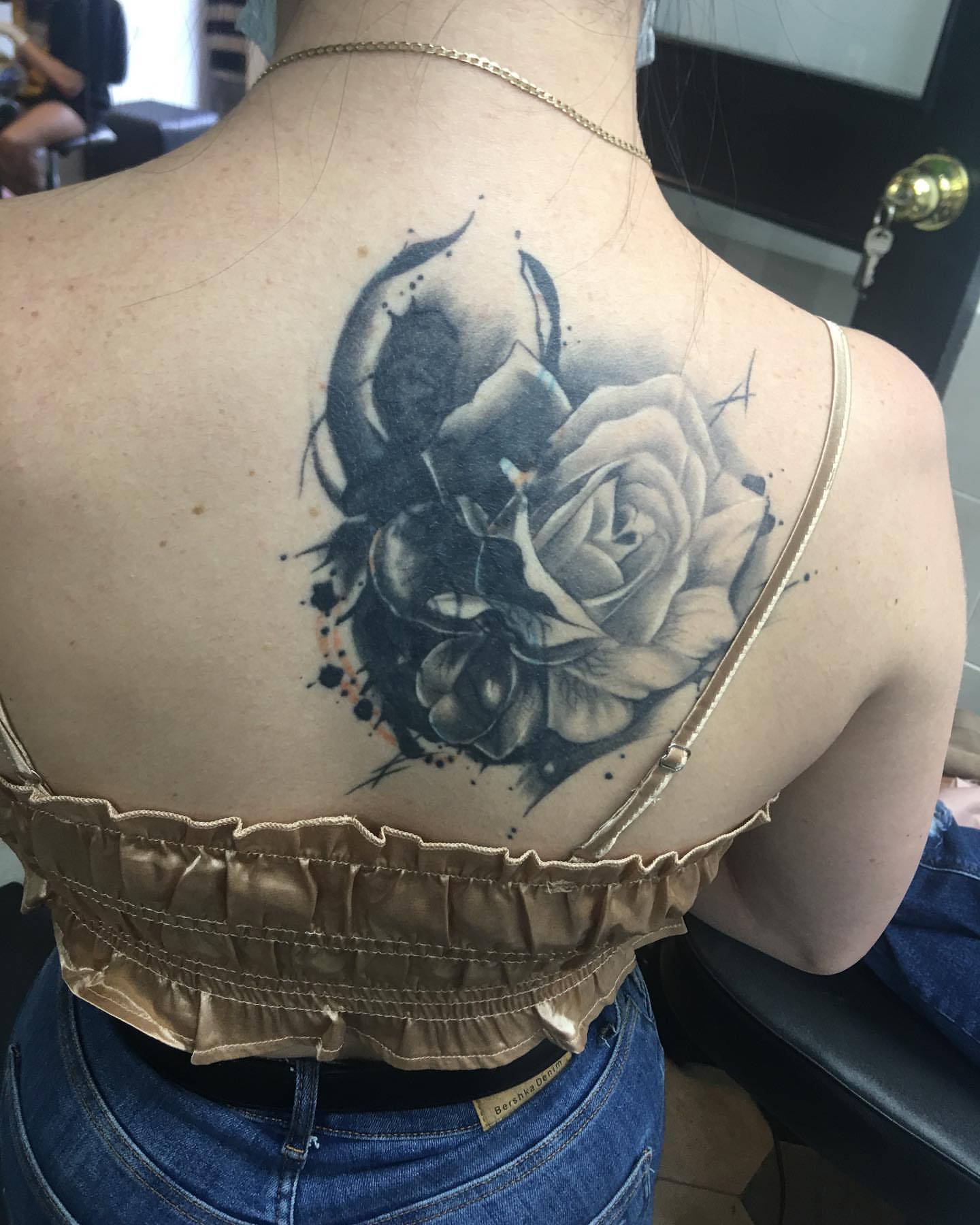 Rose realism tattoo on the back by Gabriel Garcia