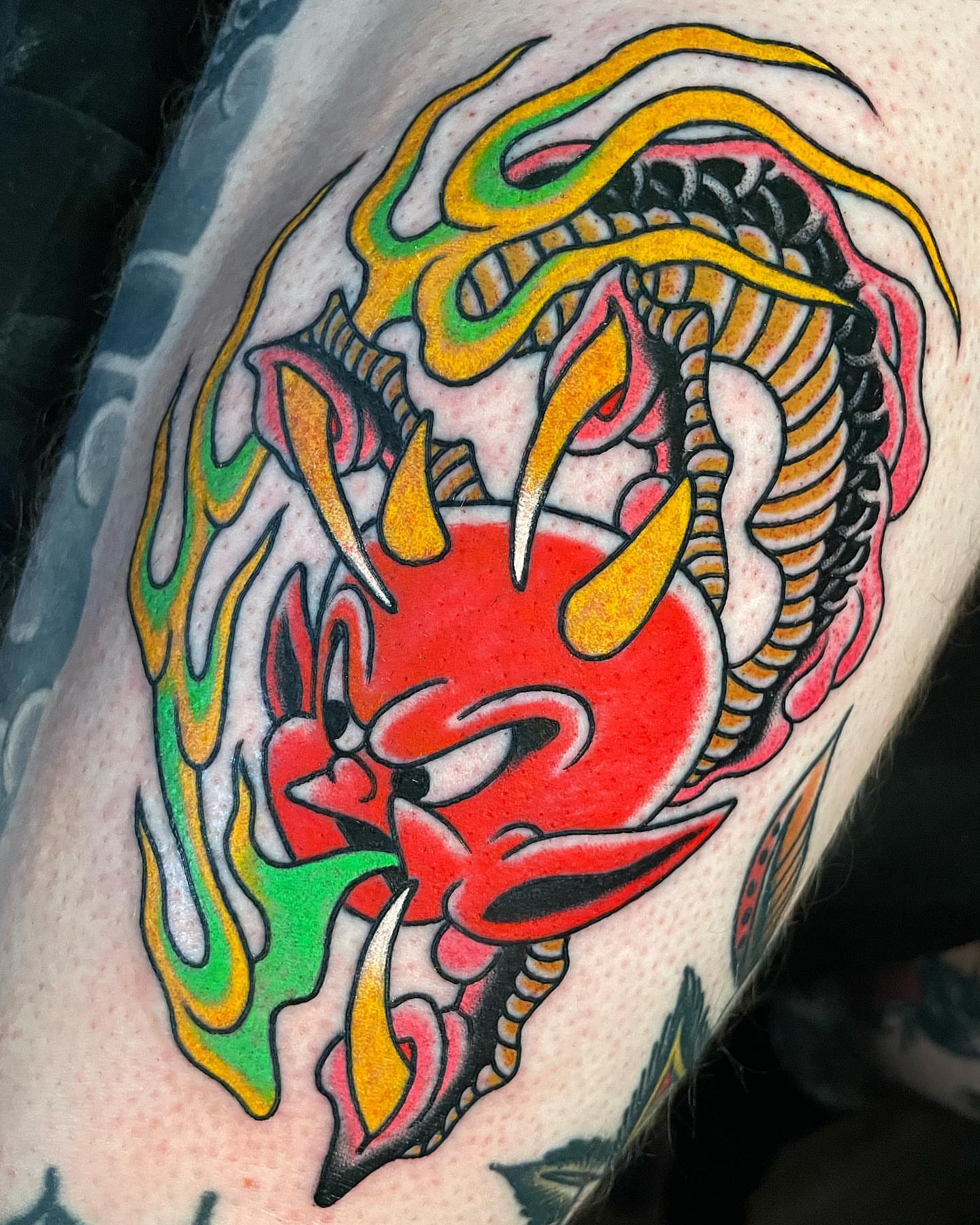 Demon head American traditional tattoo on the forearm by Frank Mostek