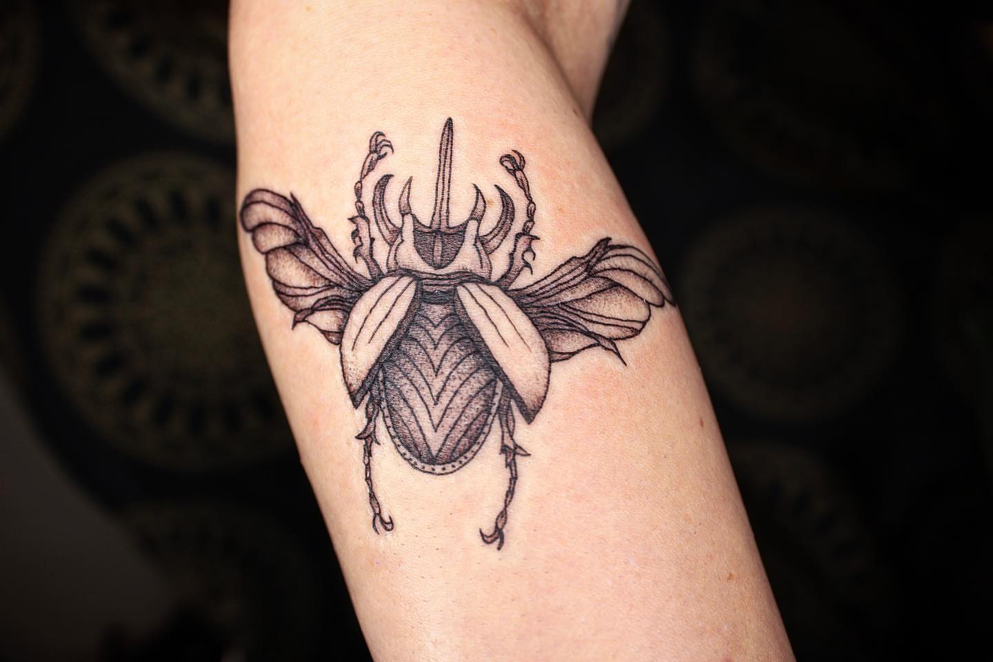 Scarab beetle dotwork tattoo on the forearm by Aim 🤍