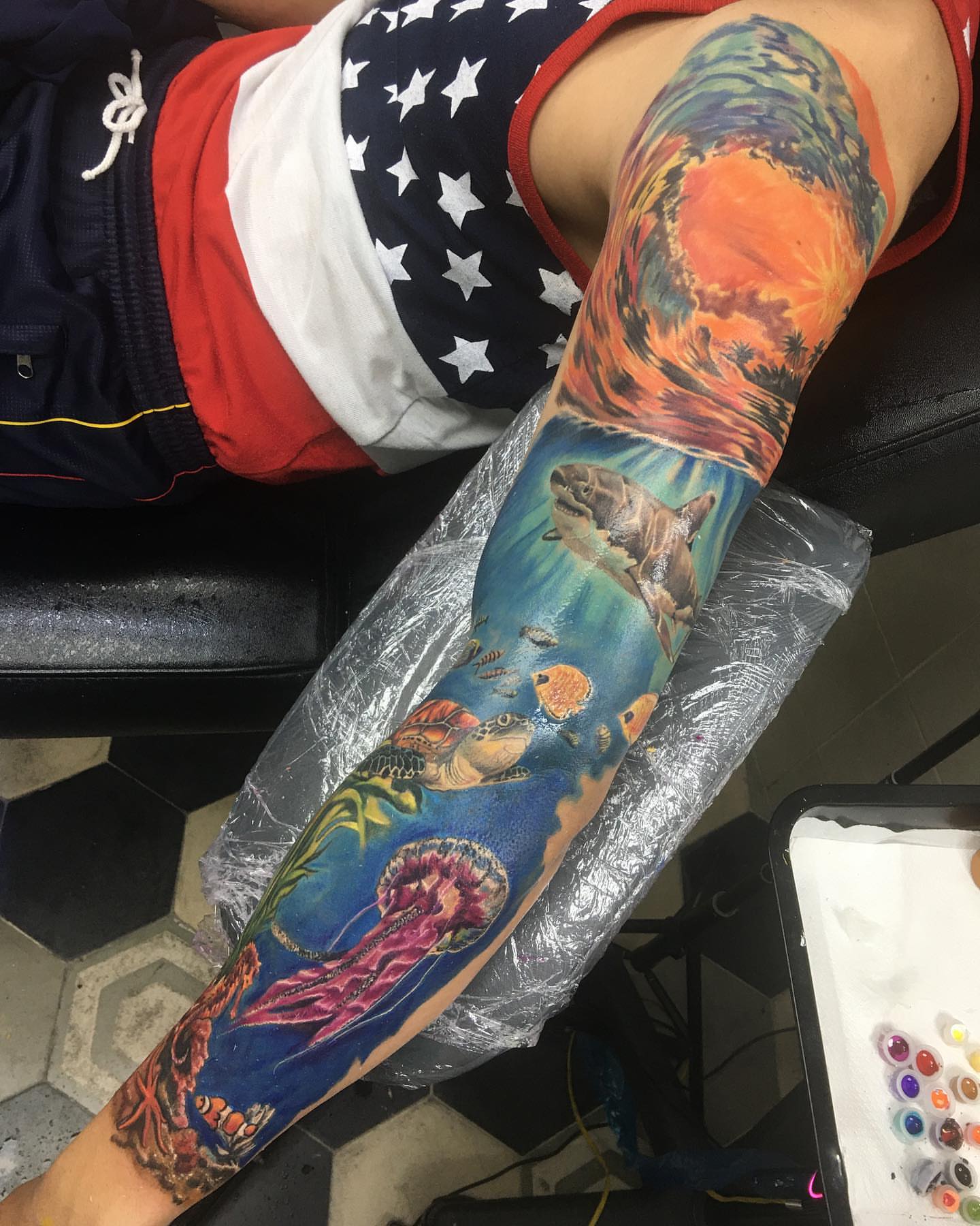 Underwater scene new school tattoo on the upper arm by Gabriel Garcia
