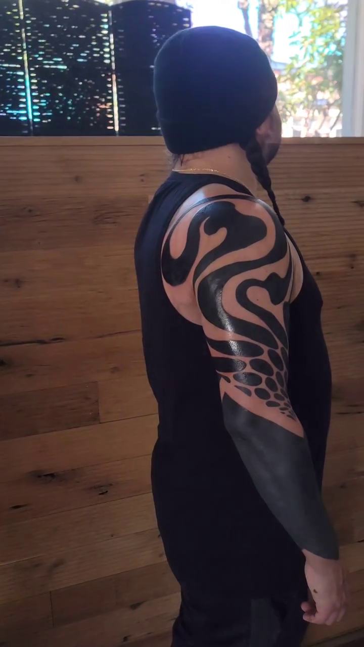 Abstract tribal pattern blackwork tattoo by Kevin Ligabue