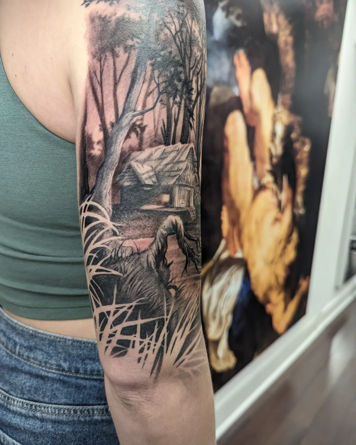 Haunted house realism tattoo on the forearm by Sean Costello