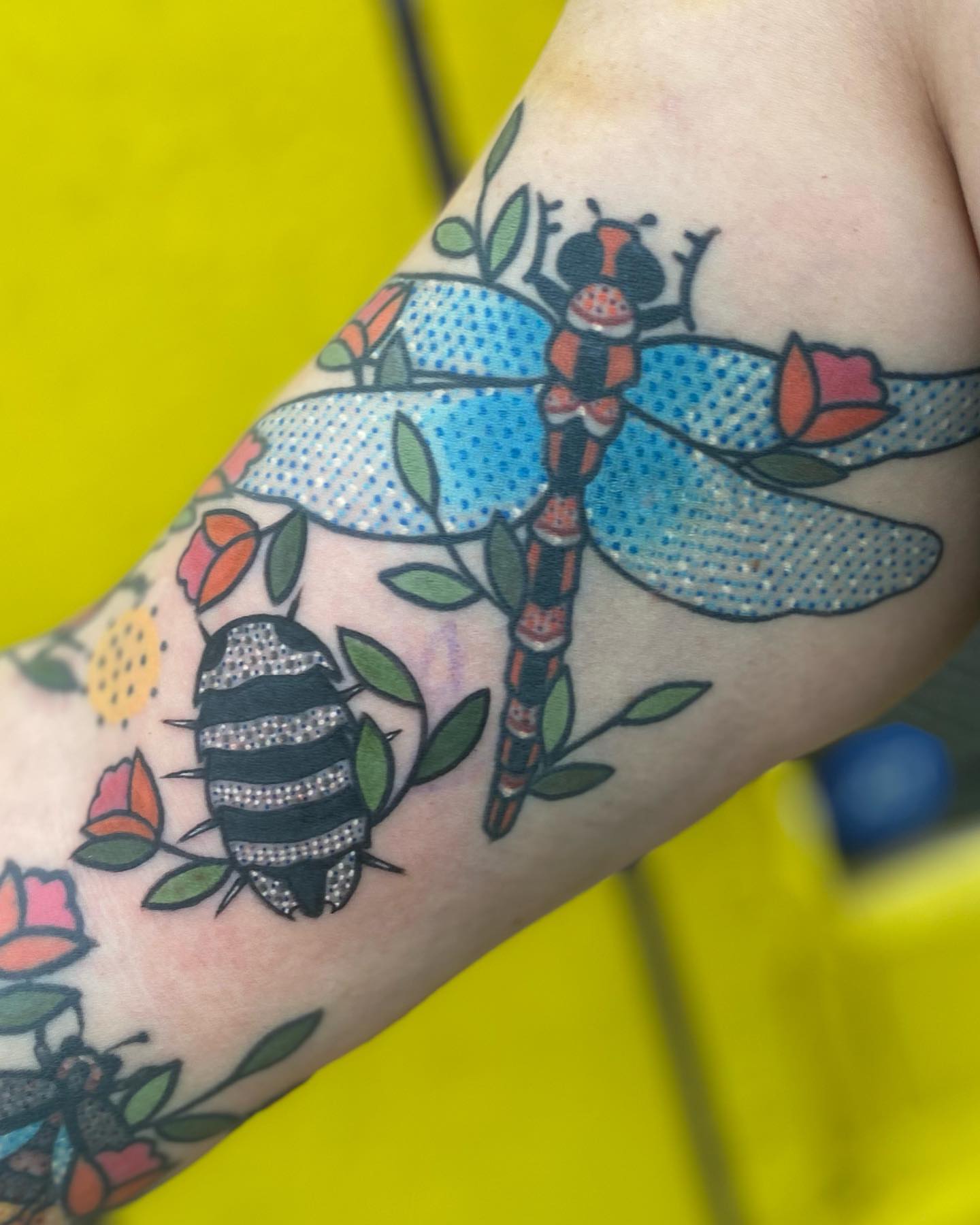 Dragonfly and bee dotwork tattoo on the forearm by Rat Girl, Dayton, Ohio