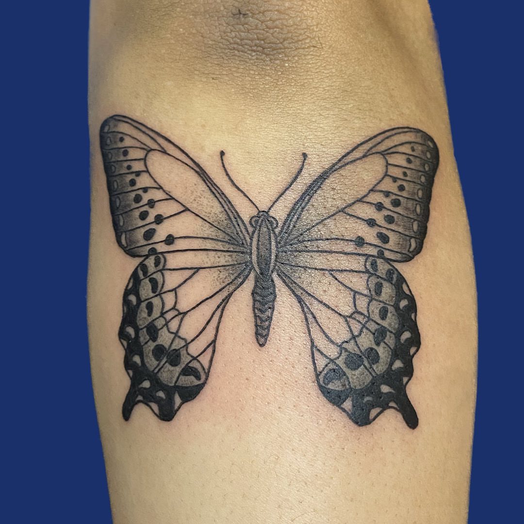 Butterfly black and grey tattoo on the forearm by Too Zen