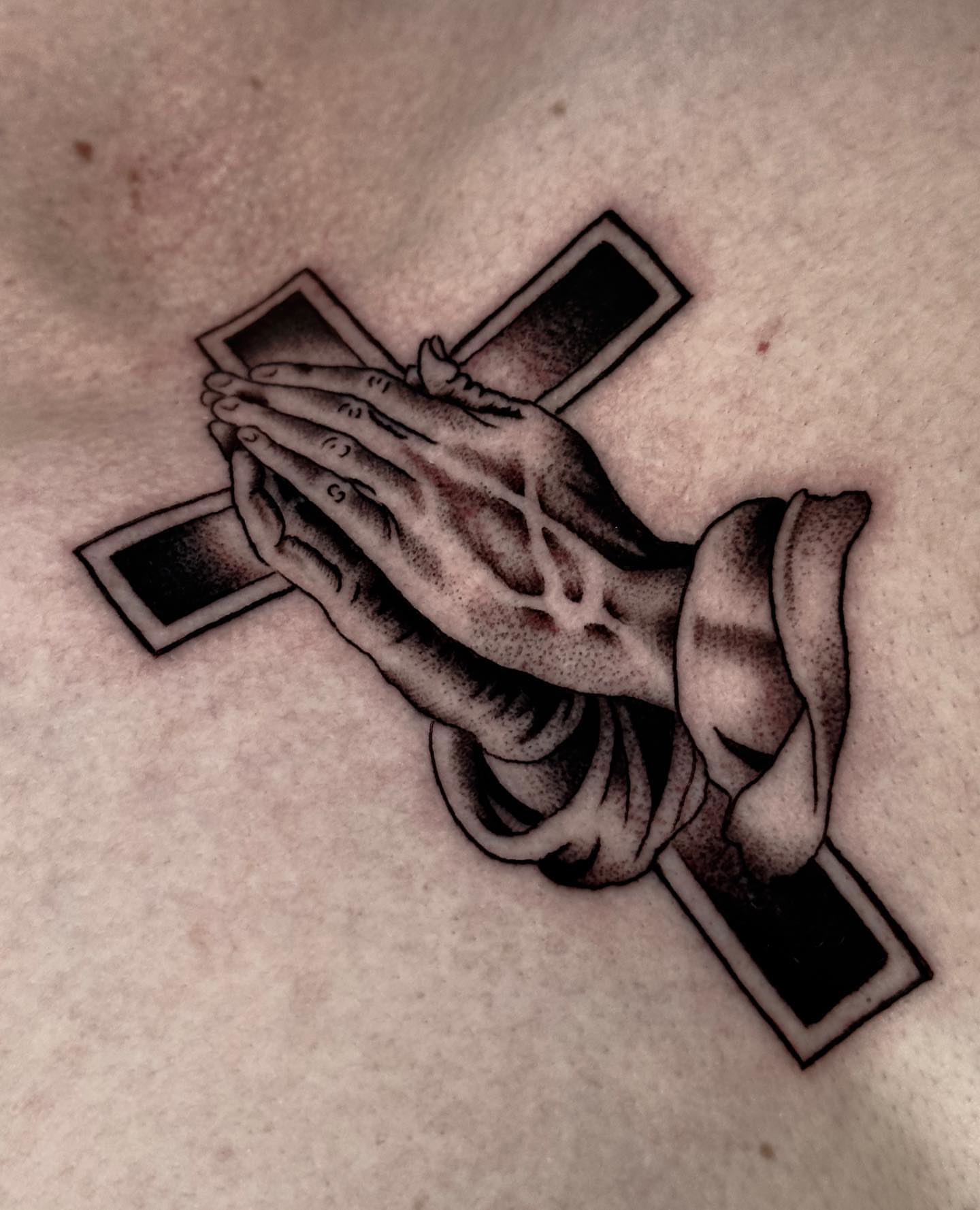 Praying hands black and grey tattoo on the chest by Matthew, Georgetown, Texas