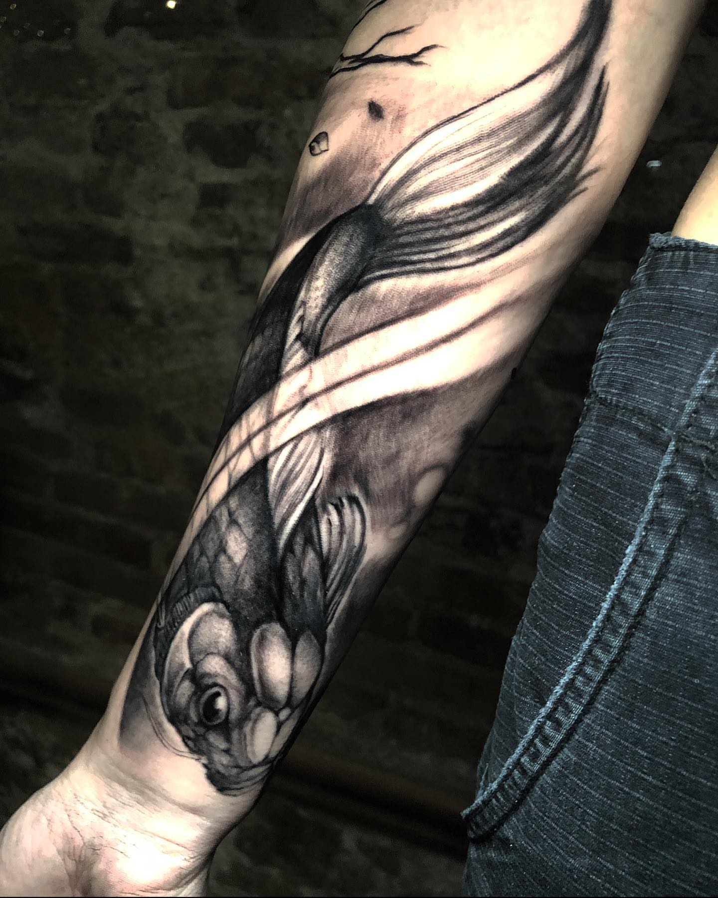 Fish black and grey tattoo on the forearm by Xavi Xiva TATTOO