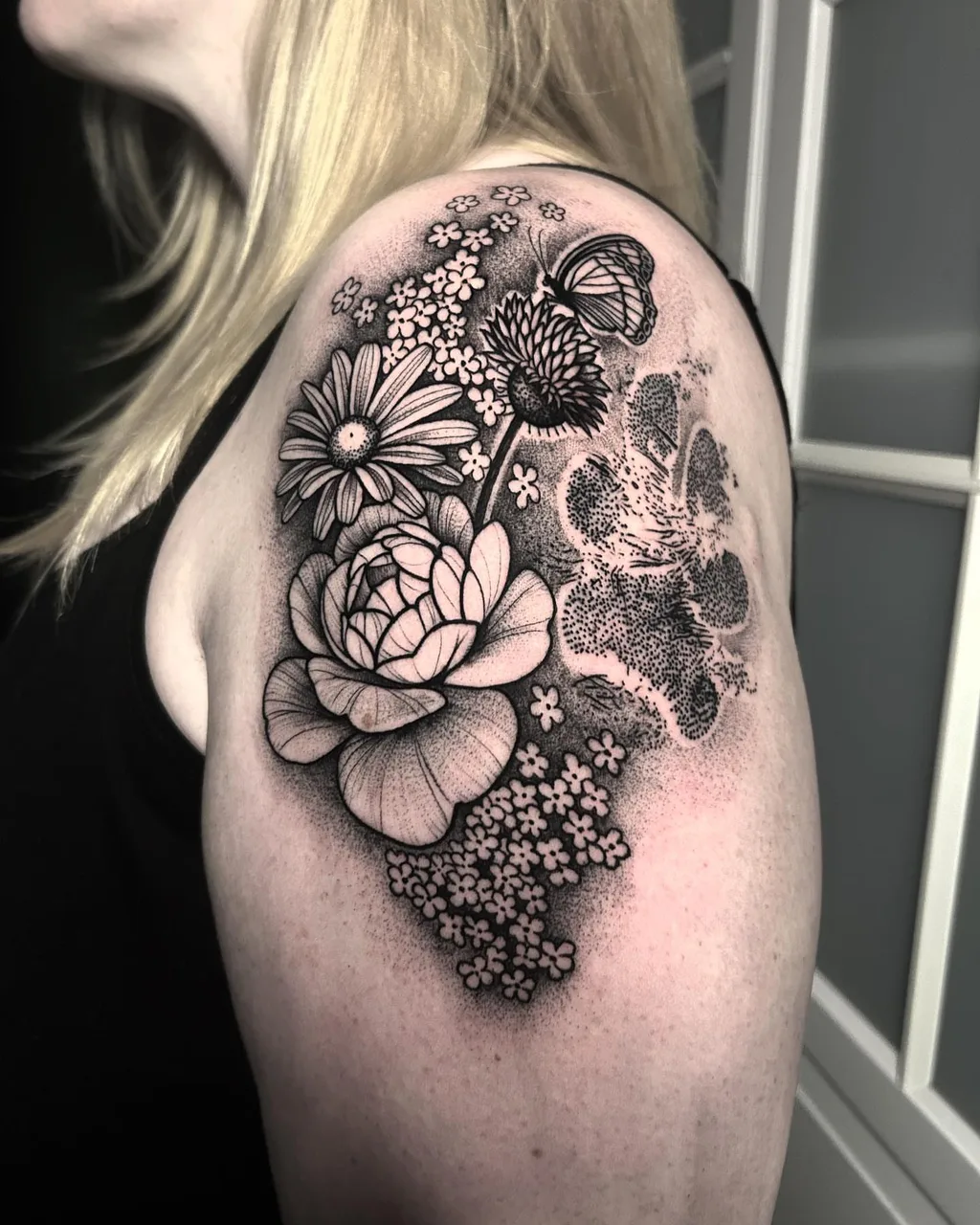 Floral arrangement dotwork tattoo on the shoulder by David Mushaney