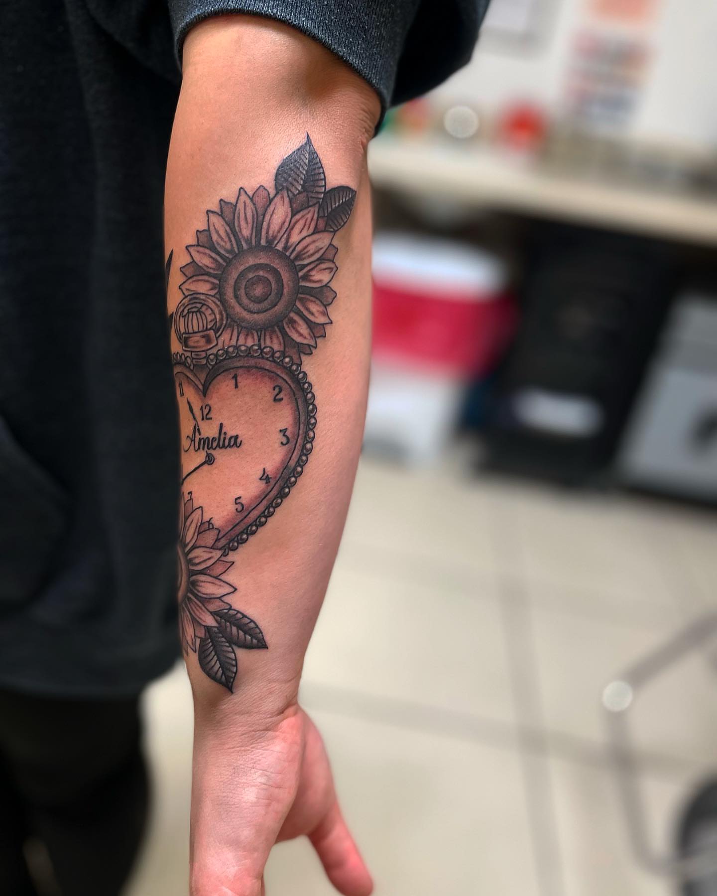 Sunflower clock American traditional tattoo on the forearm by Las Vegas Tattoo Artist