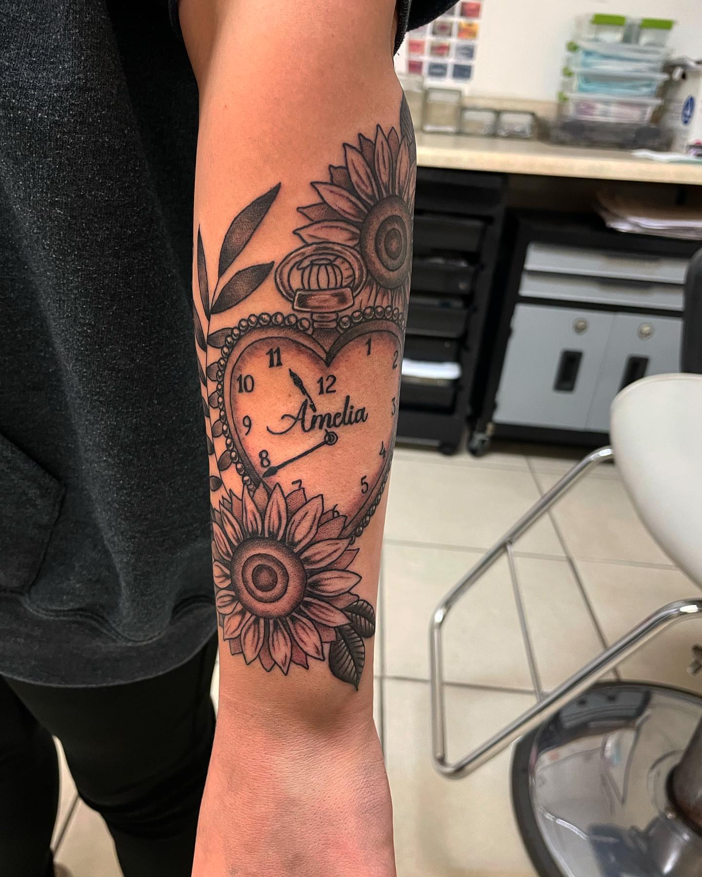 Heart clock black and grey tattoo on the forearm by Las Vegas Tattoo Artist